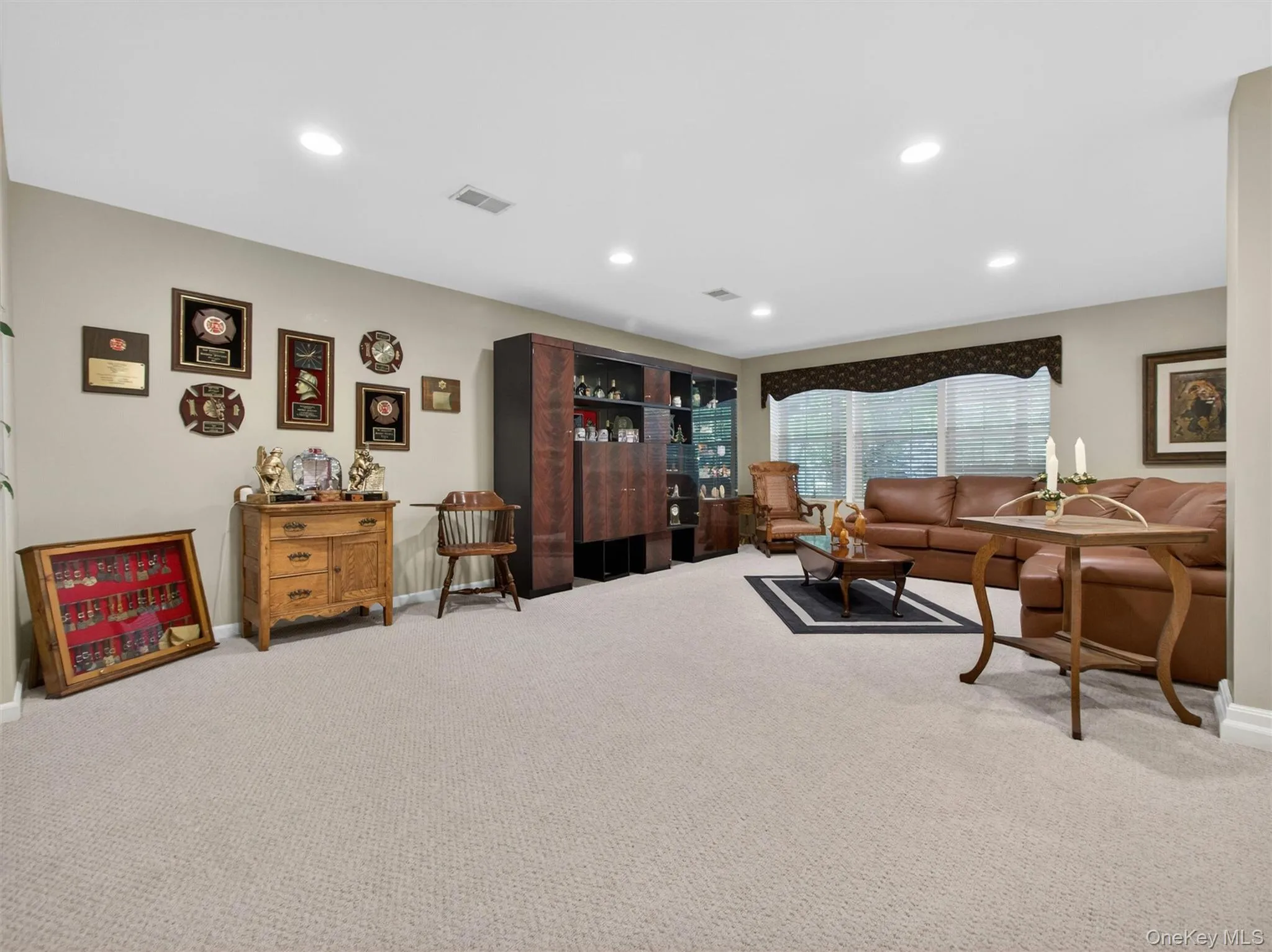 Another basement view. The wall-unit will remain at no additional cost to the buyer. Another basement view. The wall-unit will remain at no additional cost to the buyer.
