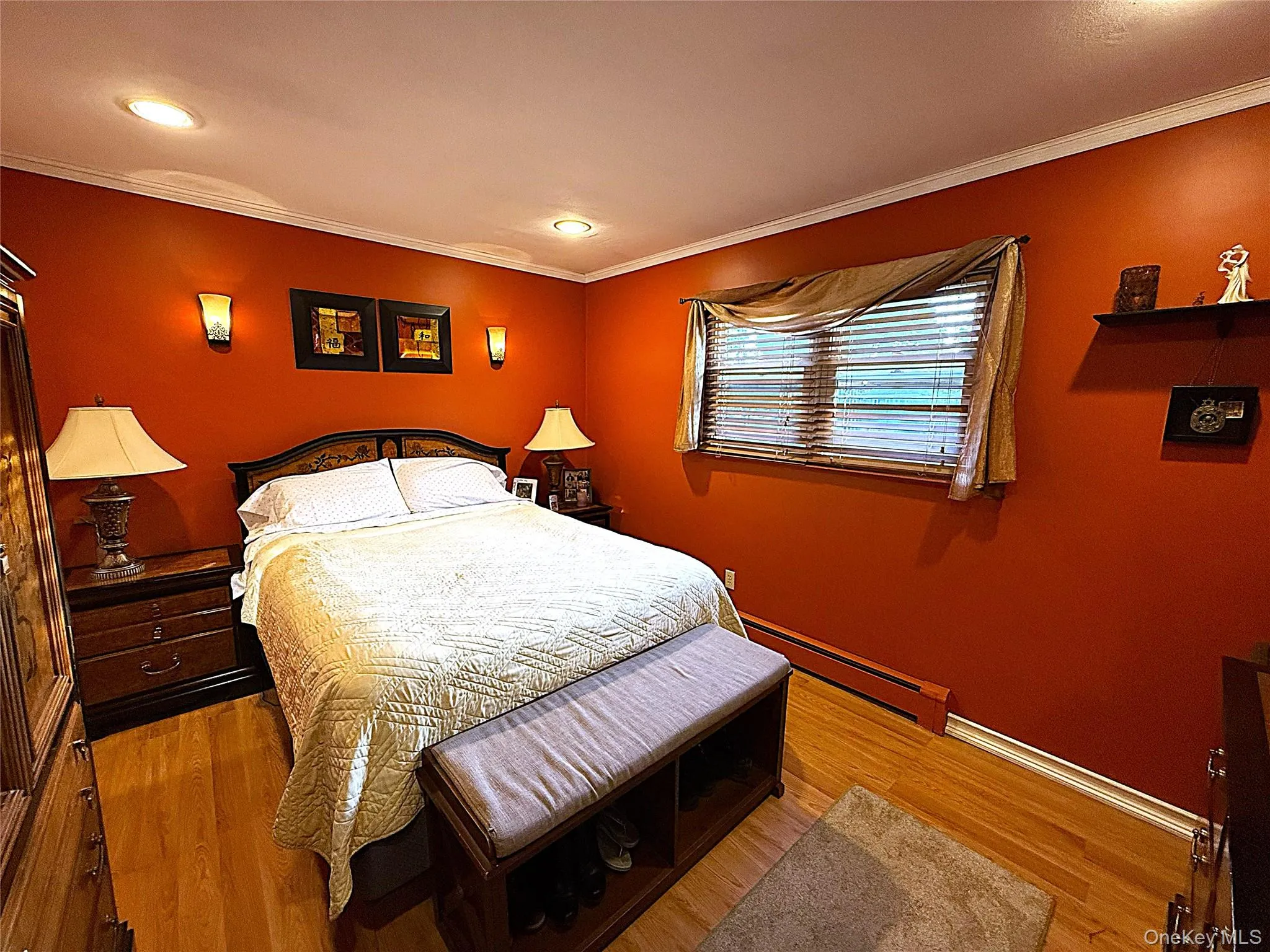 Room featuring wood-finish flooring, crown molding, and recessed lighting Room featuring wood-finish flooring, crown molding, and recessed lighting