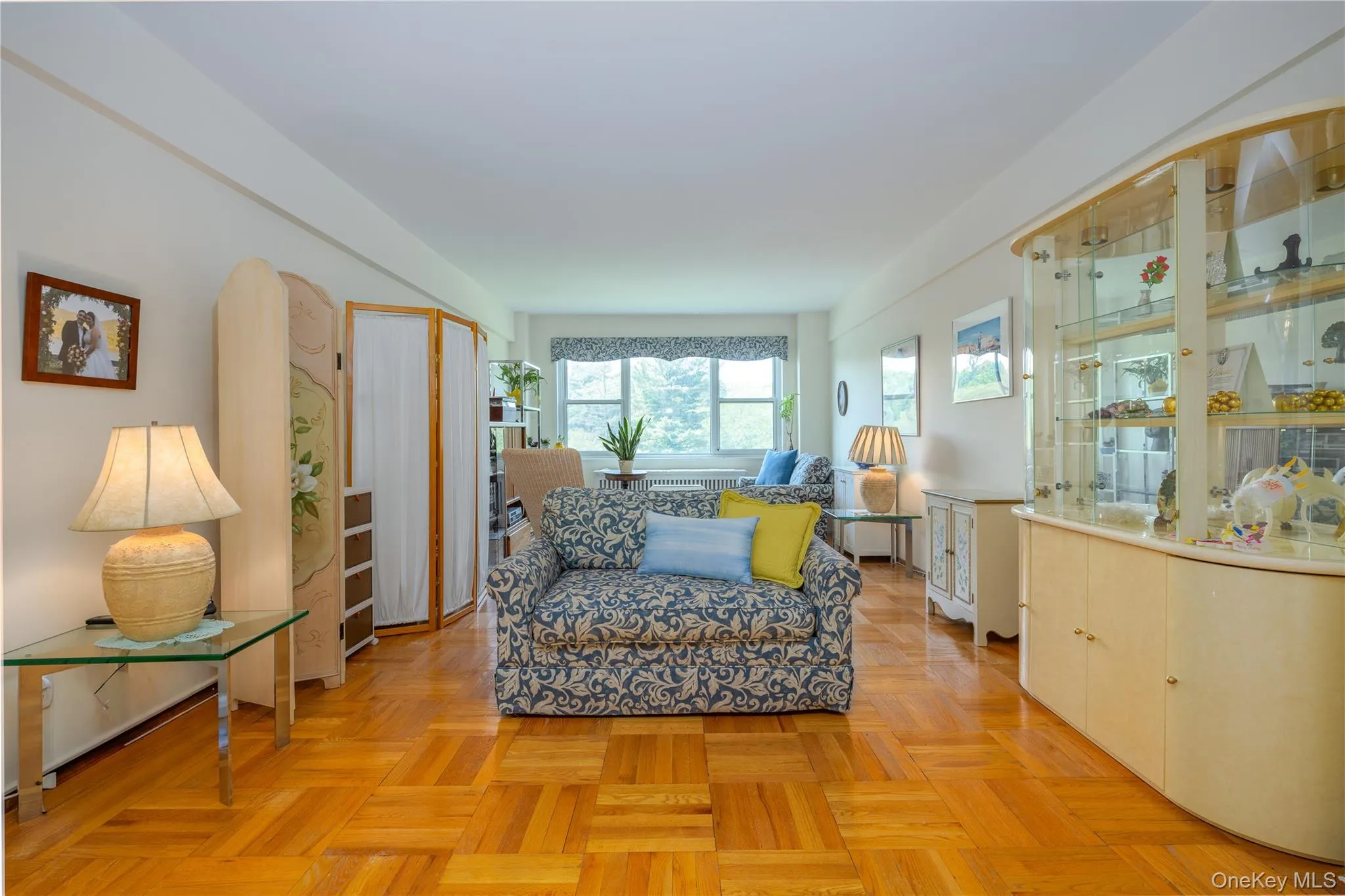 Super spacious formal living room with gleaming hardwood floors Super spacious formal living room with gleaming hardwood floors