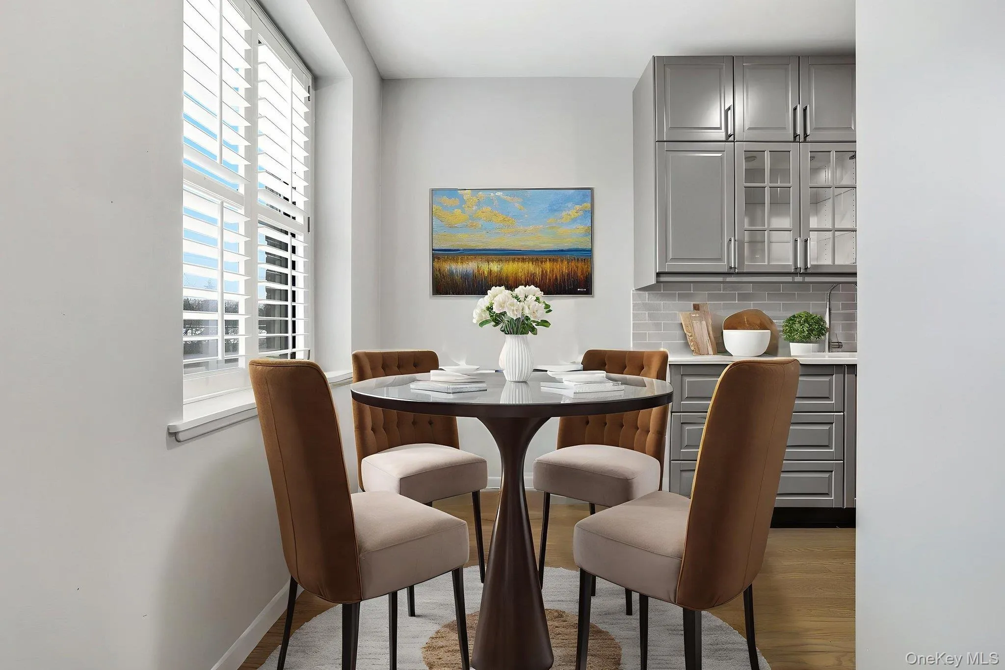 Virtually Staged Dining area featuring wood finished floors Virtually Staged Dining area featuring wood finished floors