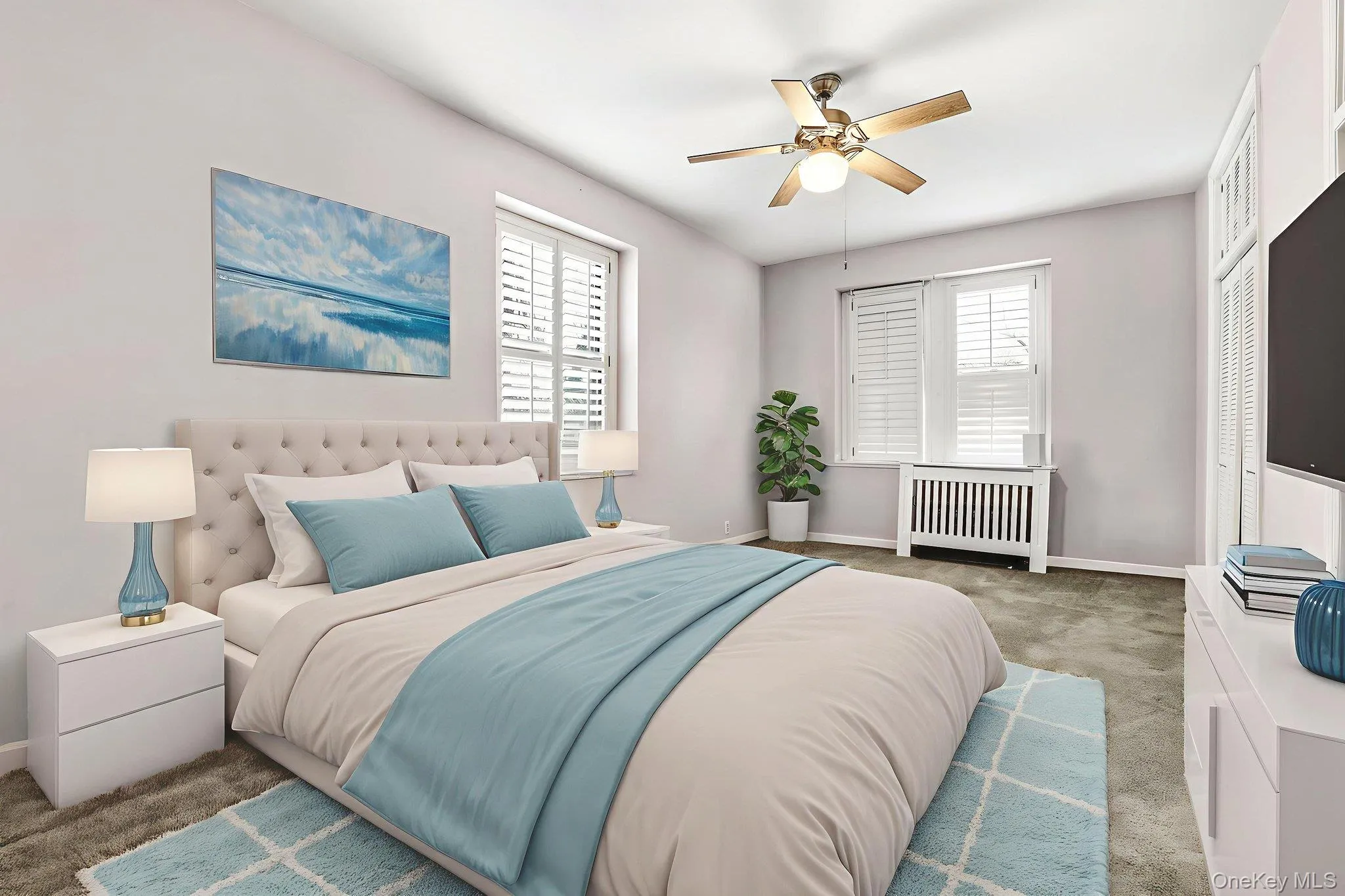 Virtually Staged Bedroom featuring carpet, radiator heating unit, ceiling fan, and a closet Virtually Staged Bedroom featuring carpet, radiator heating unit, ceiling fan, and a closet