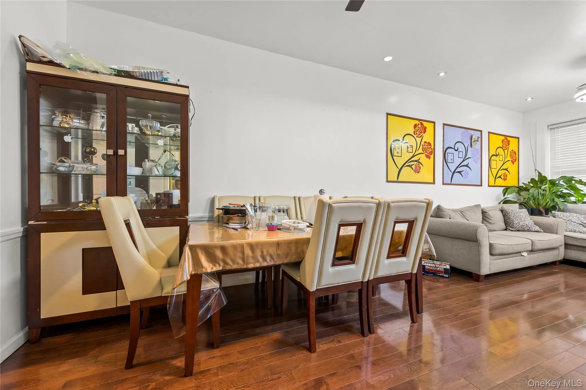 Open-concept living space with dark wood-finish flooring Open-concept living space with dark wood-finish flooring