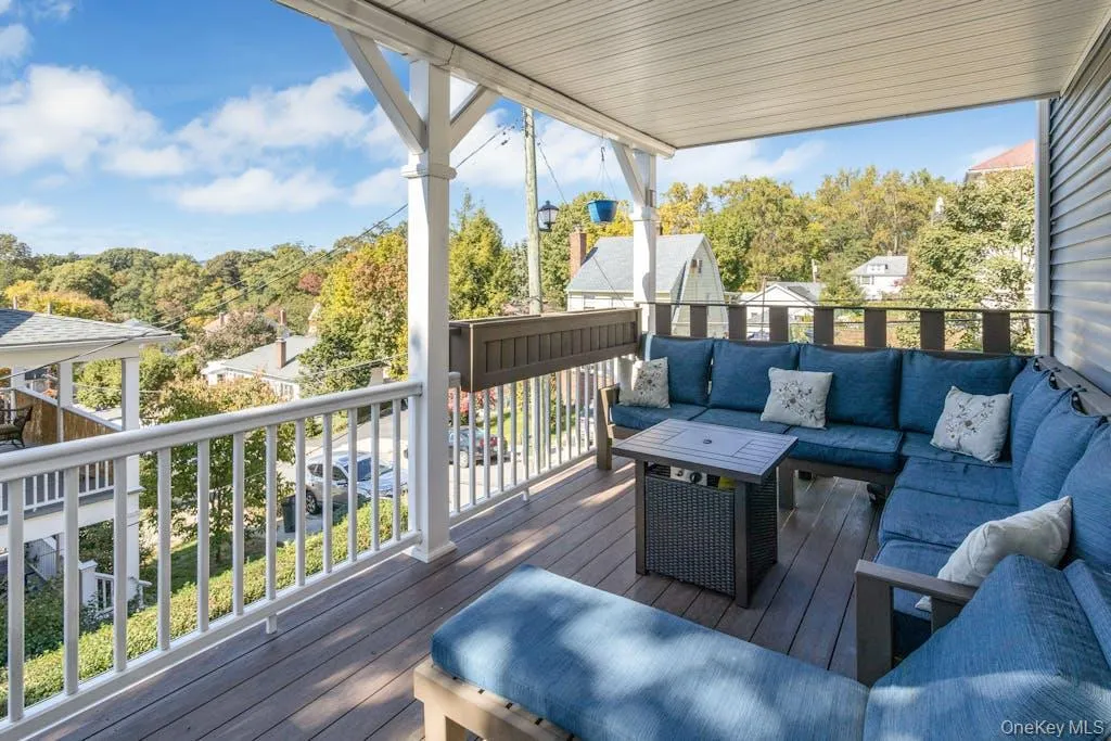 Wooden deck featuring outdoor lounge area Wooden deck featuring outdoor lounge area