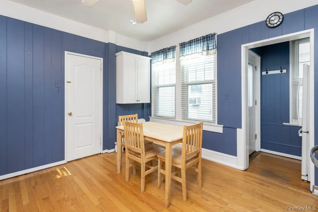 Dining area featuring ceiling fan and light hardwood / wood-style flooring Dining area featuring ceiling fan and light hardwood / wood-style flooring