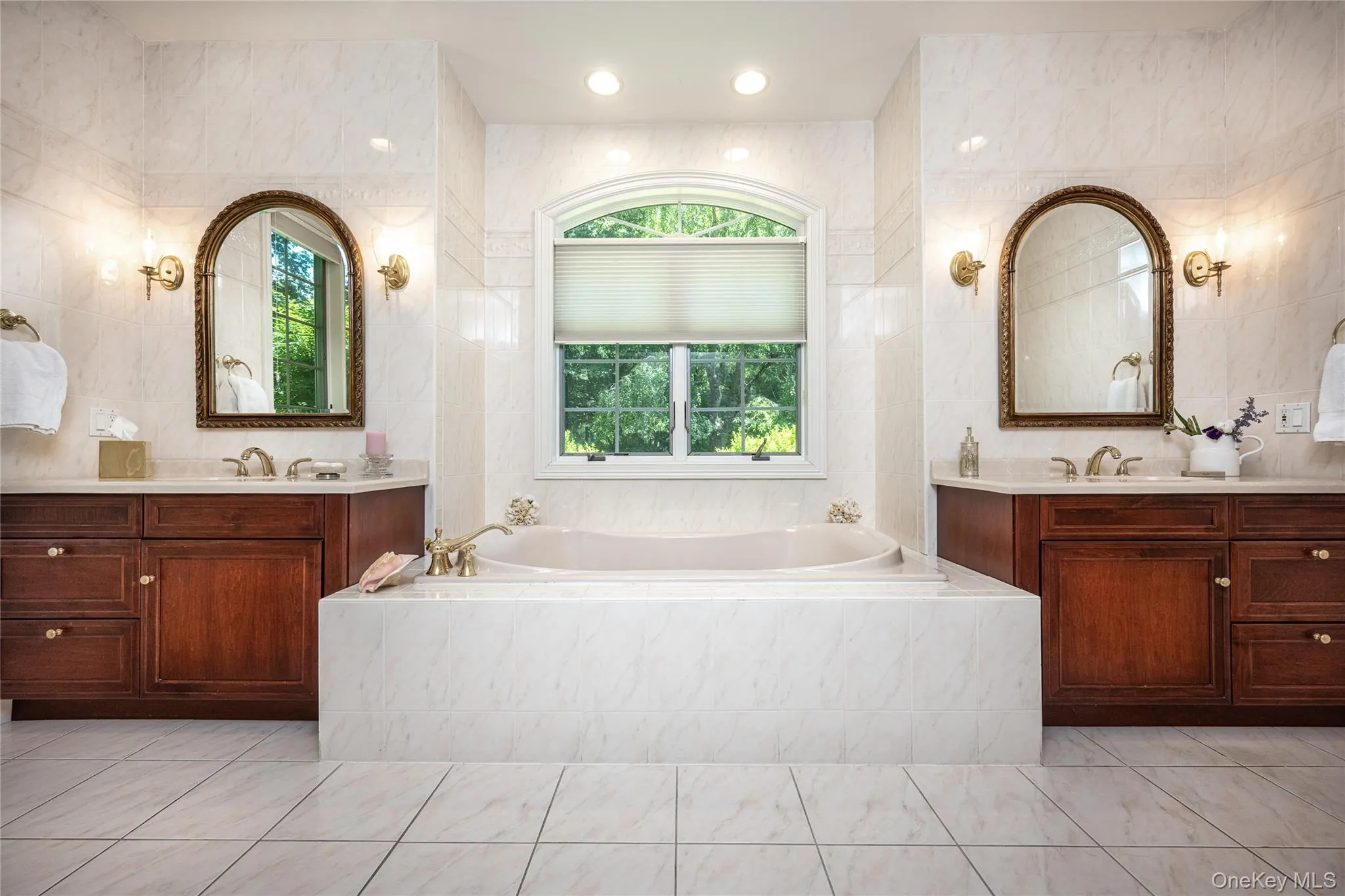 Bathroom has double sinks and soaking tub. Bathroom has double sinks and soaking tub.