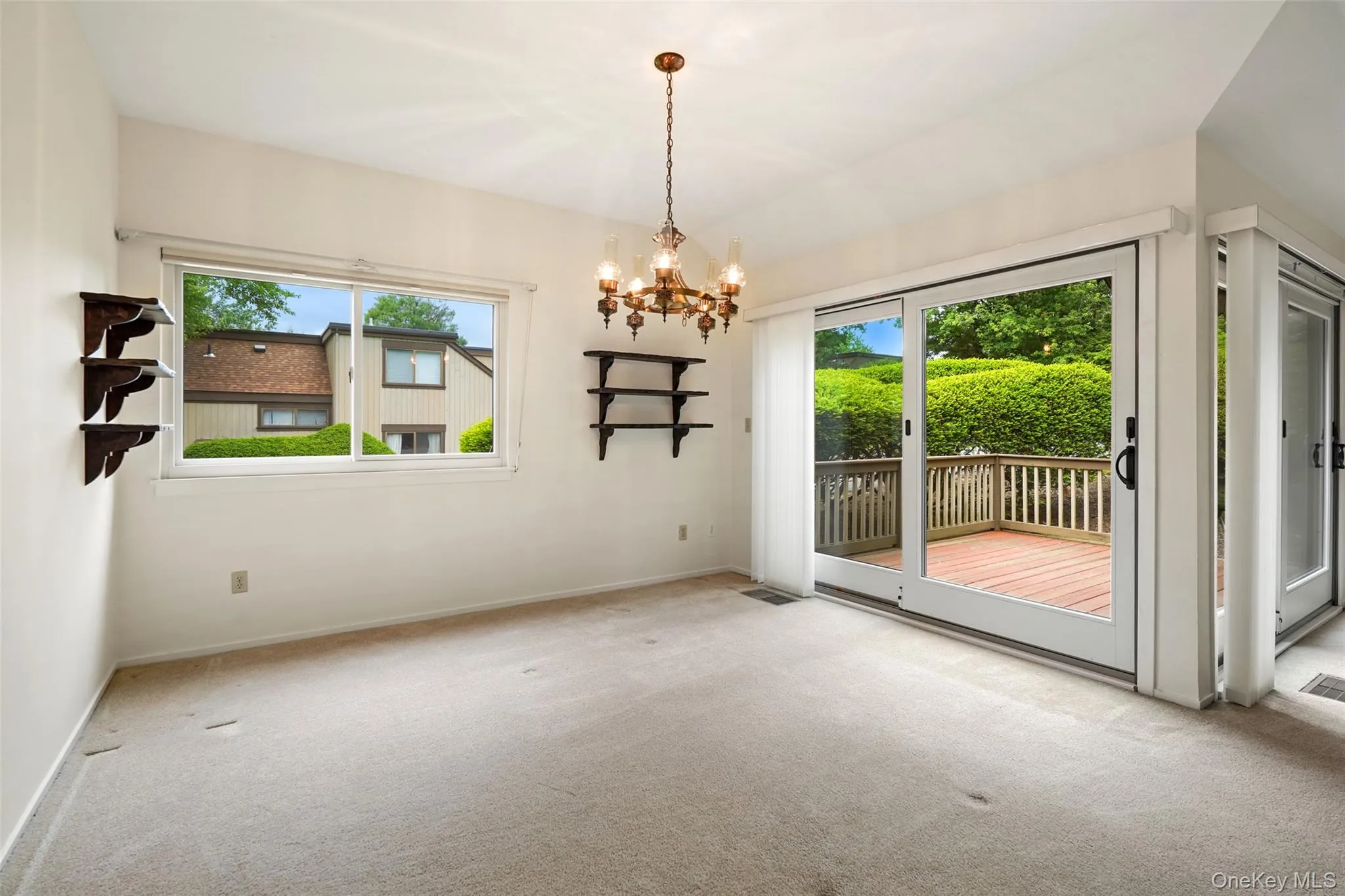 Formal dining room with Andersen slider out to backyard deck Formal dining room with Andersen slider out to backyard deck