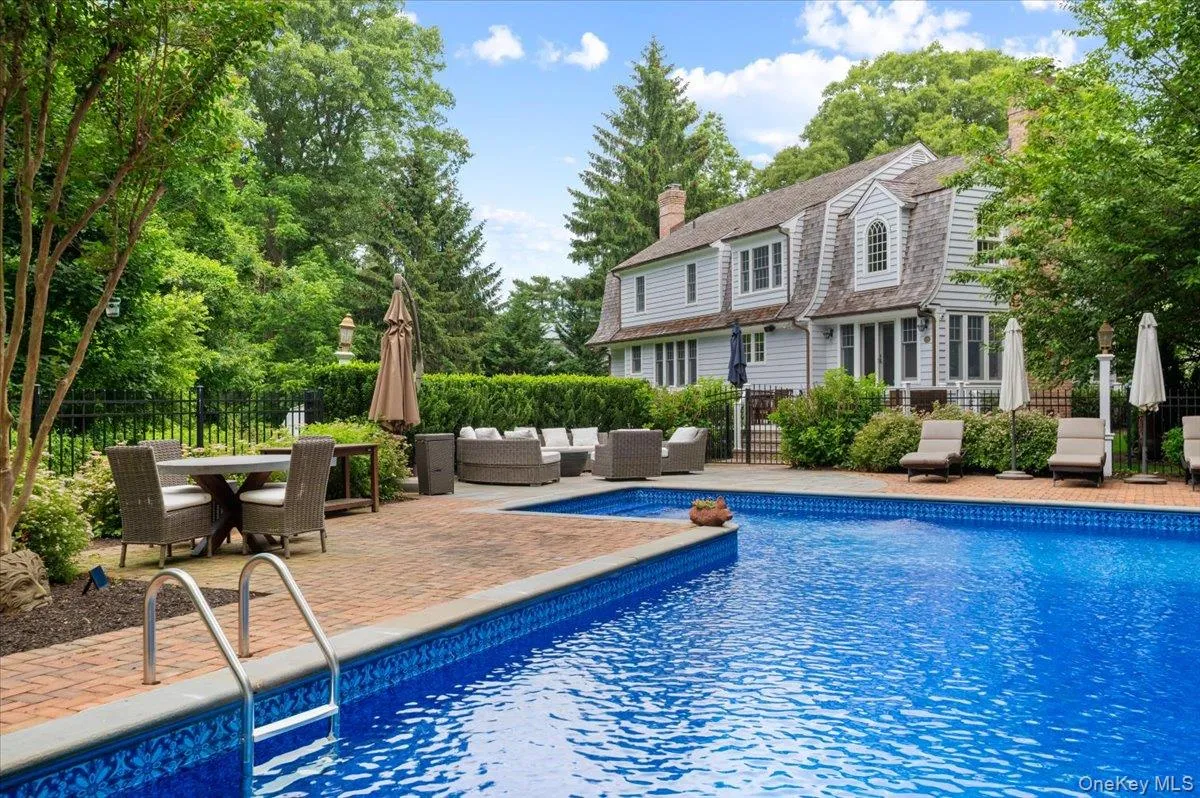 In-ground swimming pool with brick paver surround In-ground swimming pool with brick paver surround