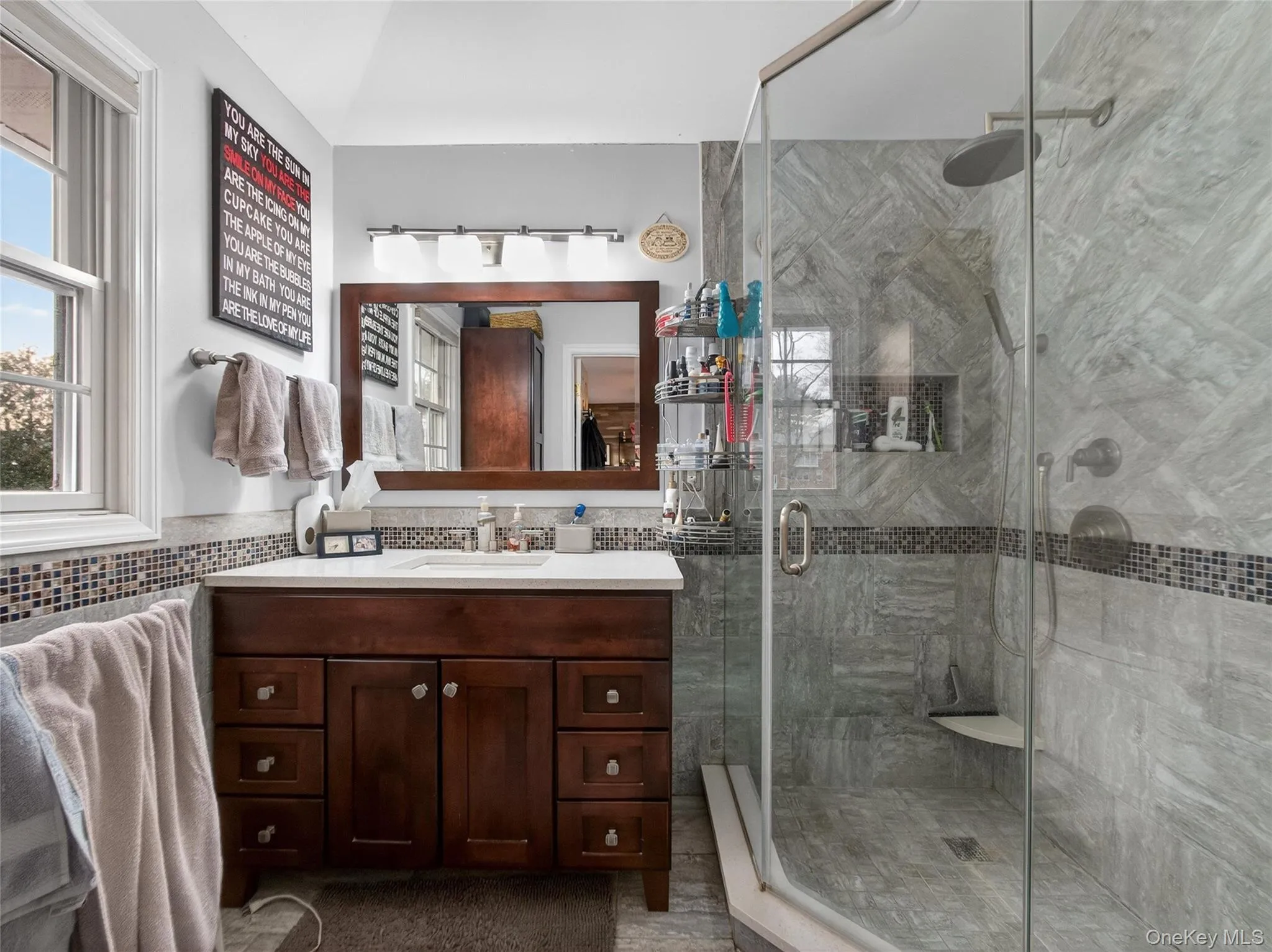 Bathroom featuring vanity and a stall shower Bathroom featuring vanity and a stall shower