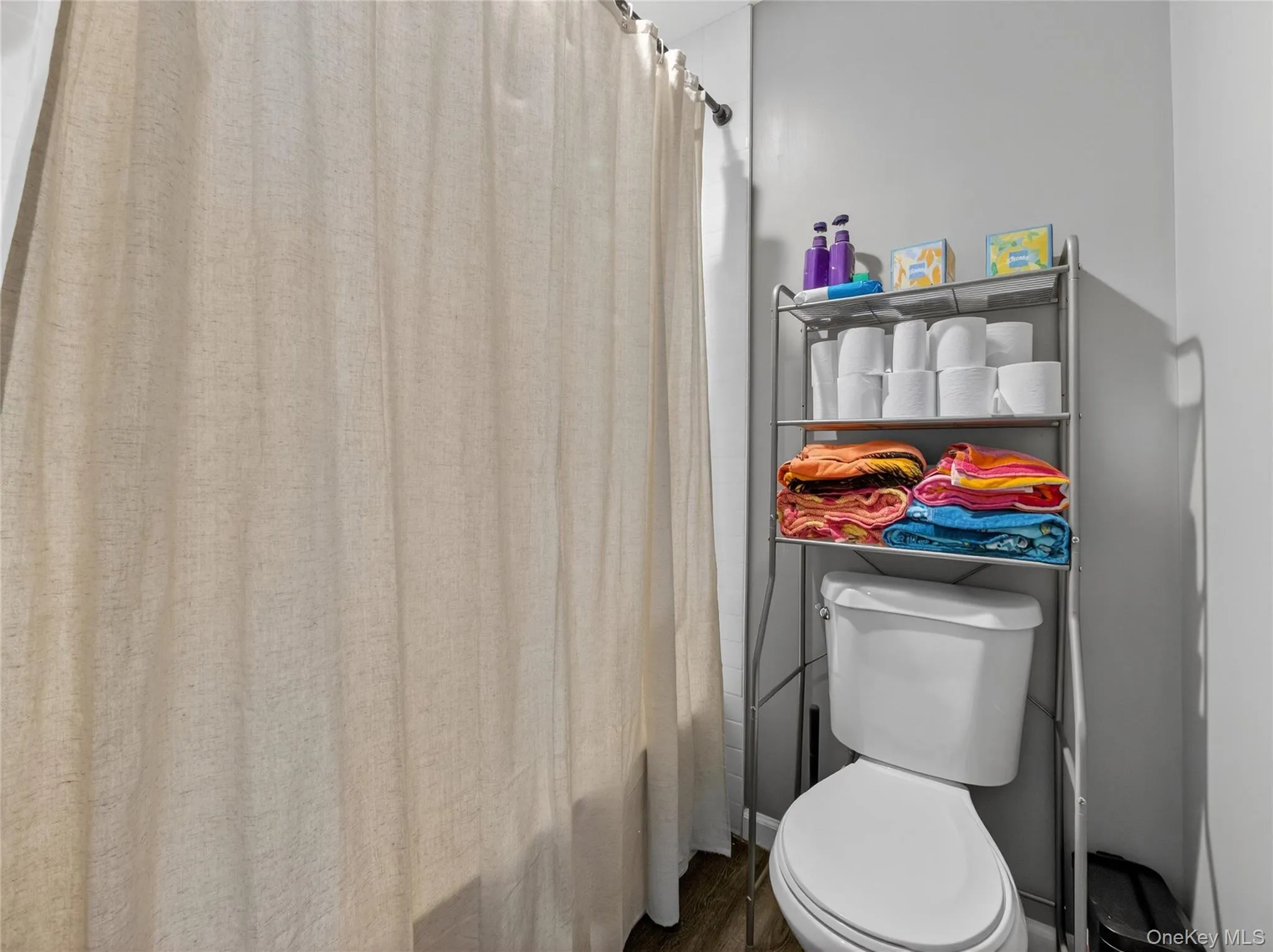 Full bathroom featuring toilet Full bathroom featuring toilet