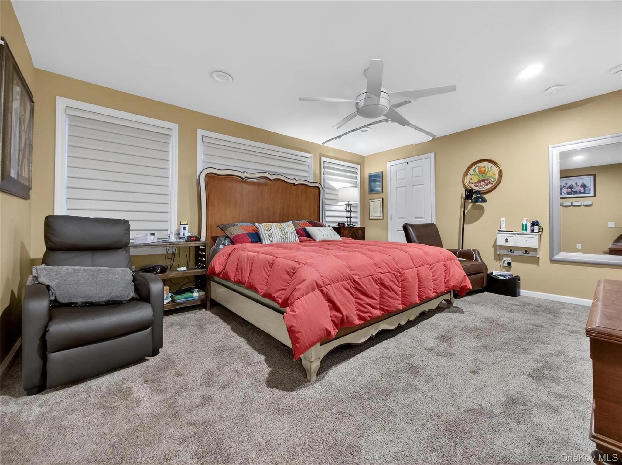 Bedroom with carpet flooring, ceiling fan, and recessed lighting Bedroom with carpet flooring, ceiling fan, and recessed lighting