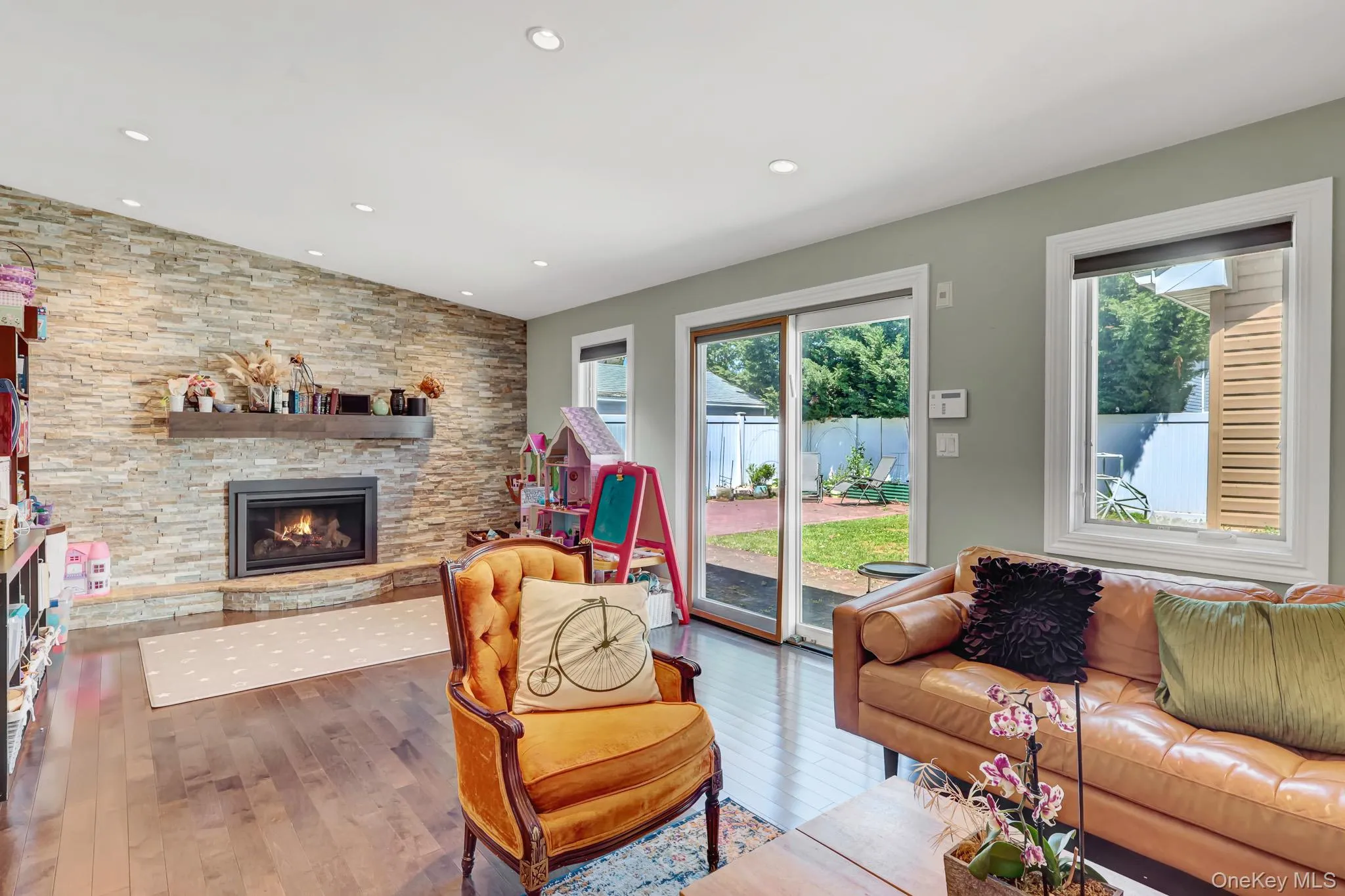 DEN WITH FIREPLACE AND ENTRANCE TO BACKYARD DEN WITH FIREPLACE AND ENTRANCE TO BACKYARD