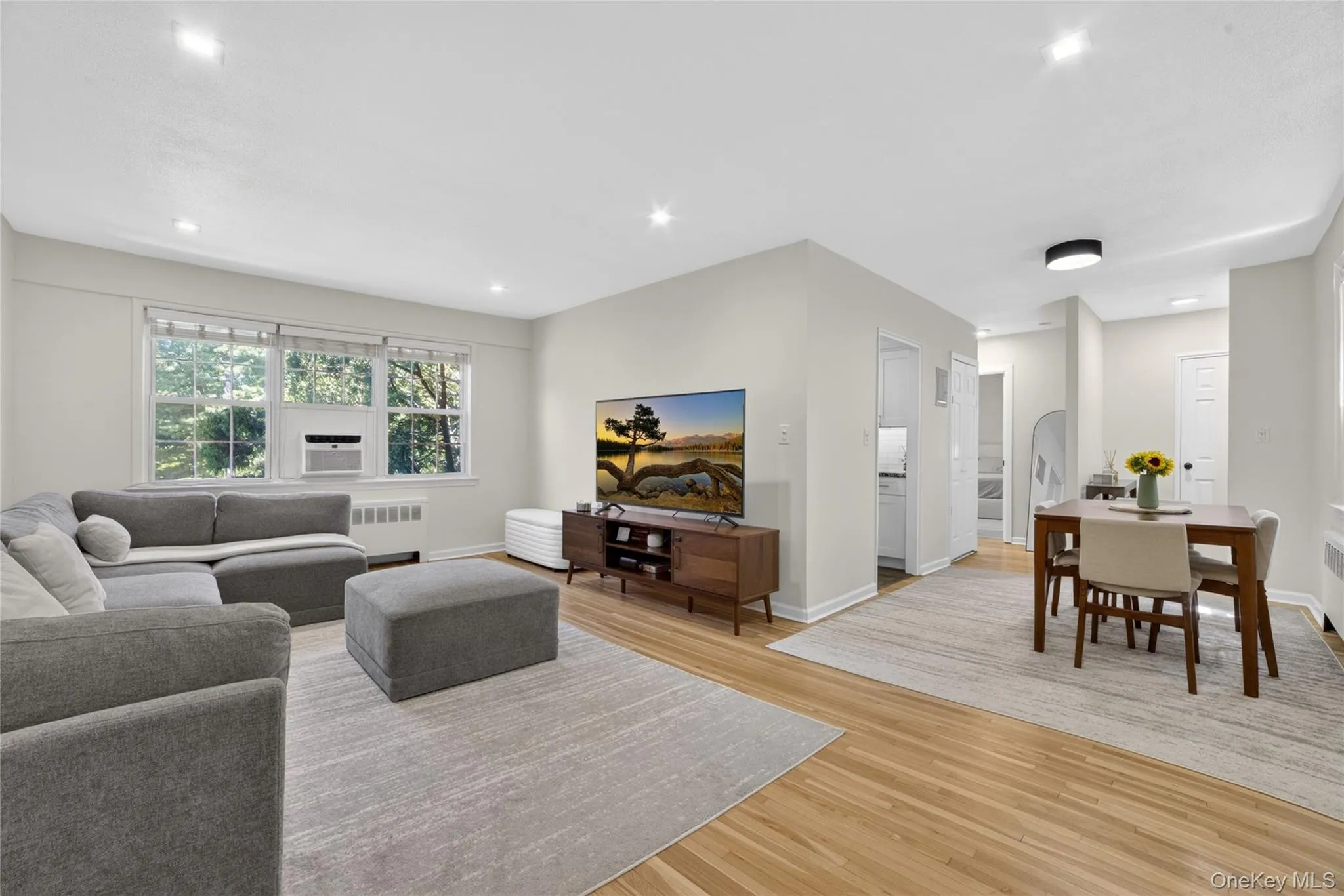 Living Room Features: Home Office Area, Recessed Lighting, Re-Finished Hardwood Floors, Grand Window View, Natural Light Living Room Features: Home Office Area, Recessed Lighting, Re-Finished Hardwood Floors, Grand Window View, Natural Light
