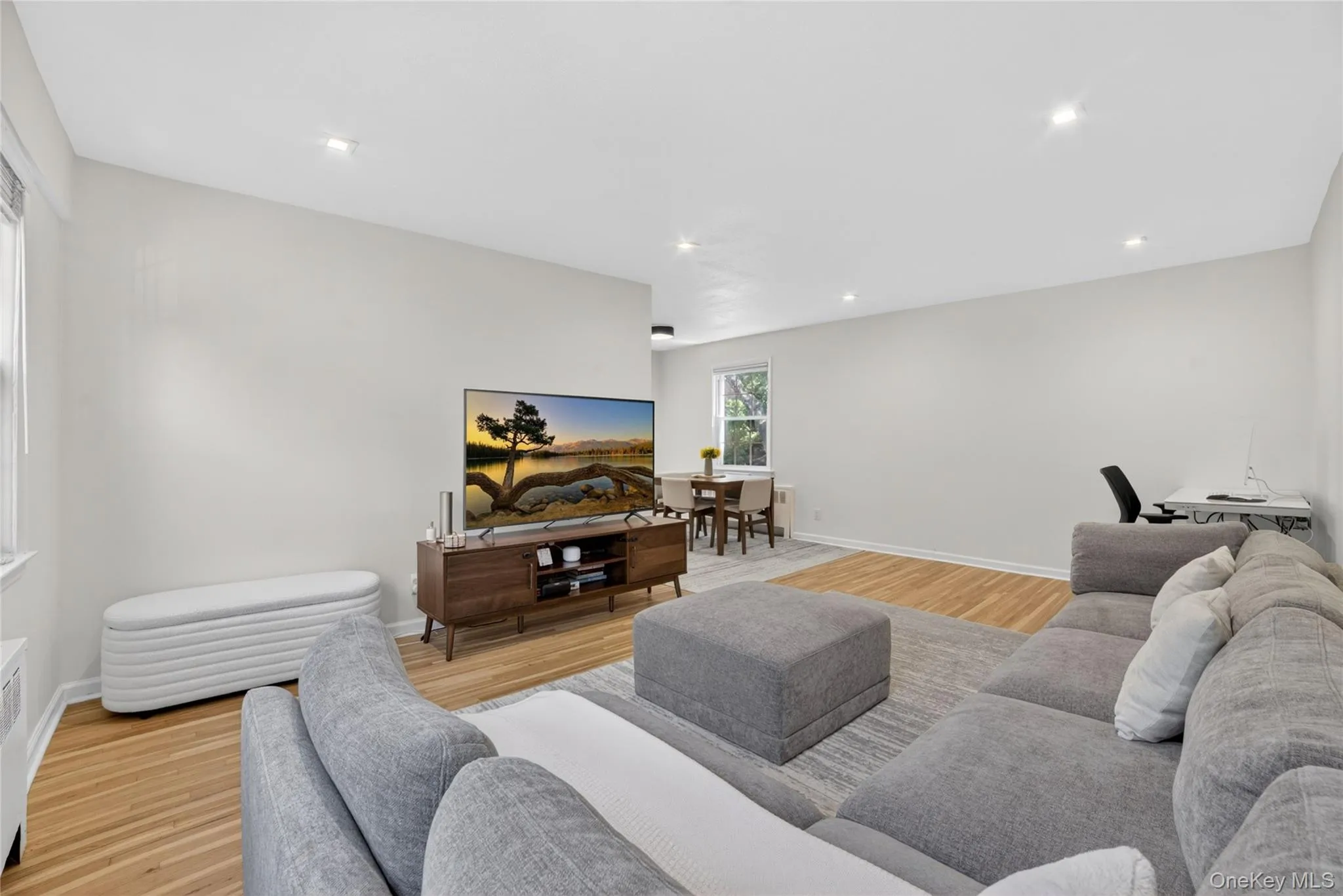 Living Room Features: Home Office Area, Recessed Lighting, Re-Finished Hardwood Floors, Grand Window View, Natural Light Living Room Features: Home Office Area, Recessed Lighting, Re-Finished Hardwood Floors, Grand Window View, Natural Light