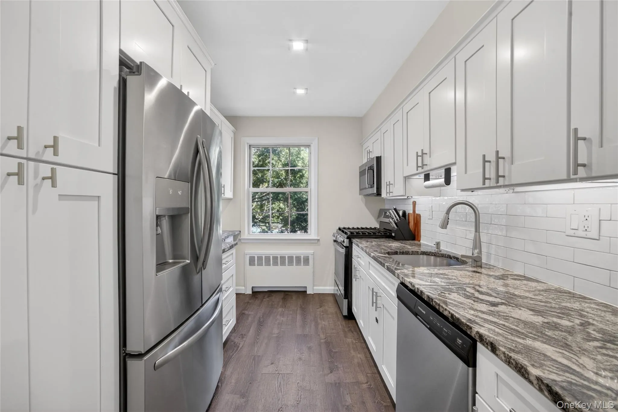 Kitchen Features: New SS Appliances, Under-cabinet Lighting, Marble Countertops, Under-mount Sink, Pantry Kitchen Features: New SS Appliances, Under-cabinet Lighting, Marble Countertops, Under-mount Sink, Pantry