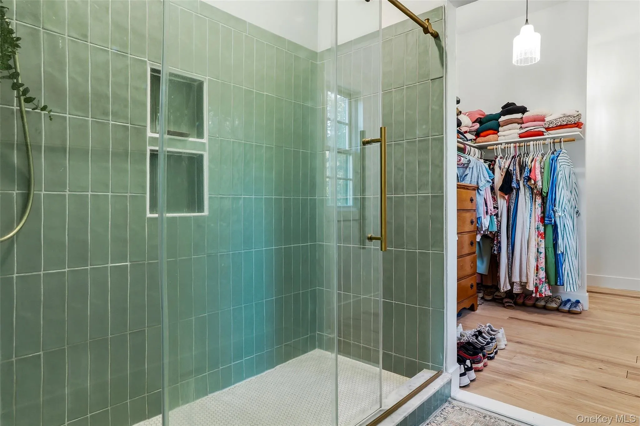 Alternate view of the primary bathroom showcasing the custom tile shower and elegant details Alternate view of the primary bathroom showcasing the custom tile shower and elegant details