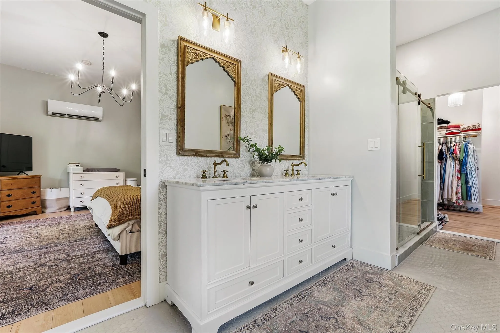 Primary bathroom featuring a double vanity and thoughtful design Primary bathroom featuring a double vanity and thoughtful design