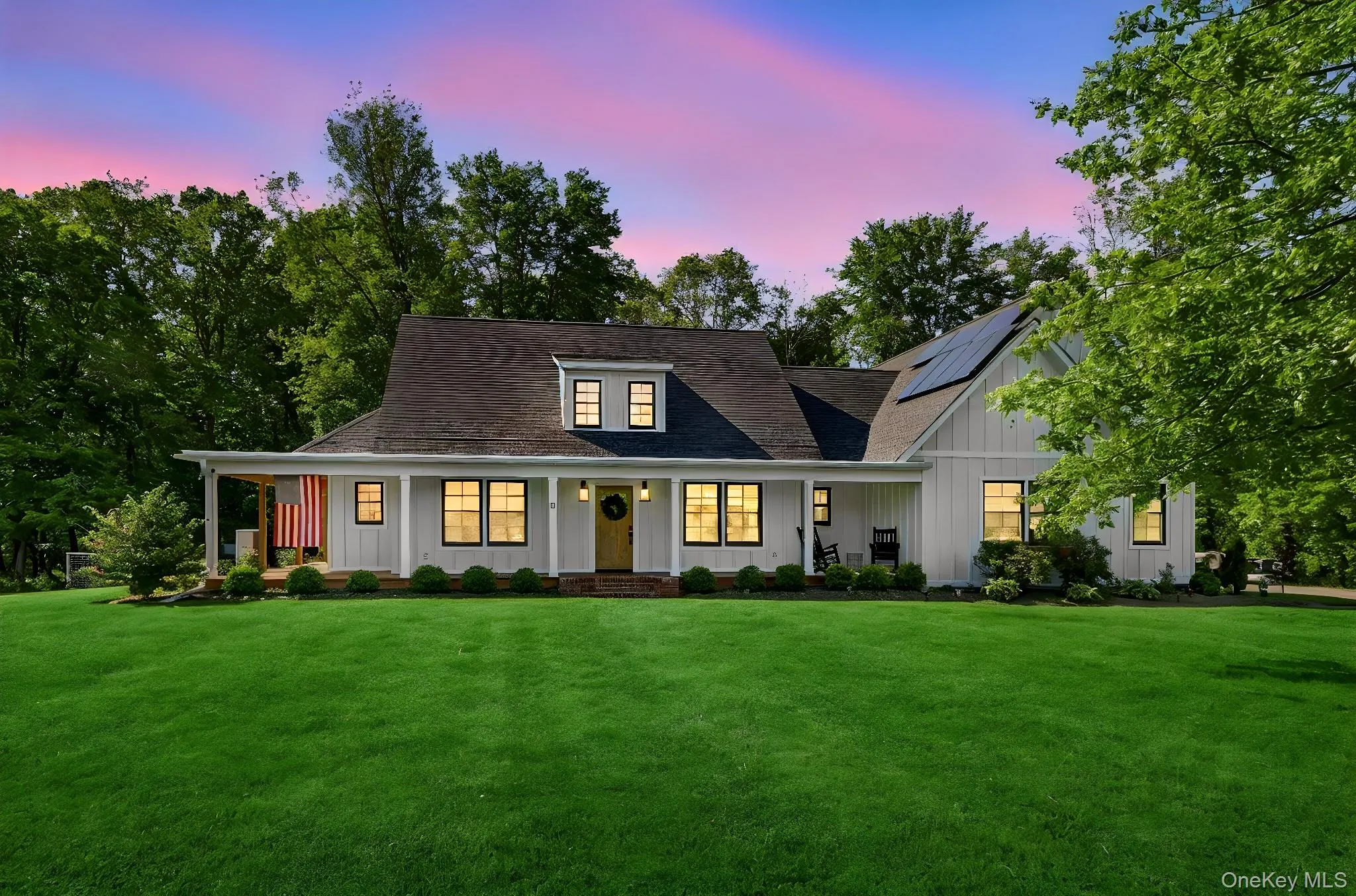 Twilight view of the home highlighting its warm and inviting curb appeal Twilight view of the home highlighting its warm and inviting curb appeal