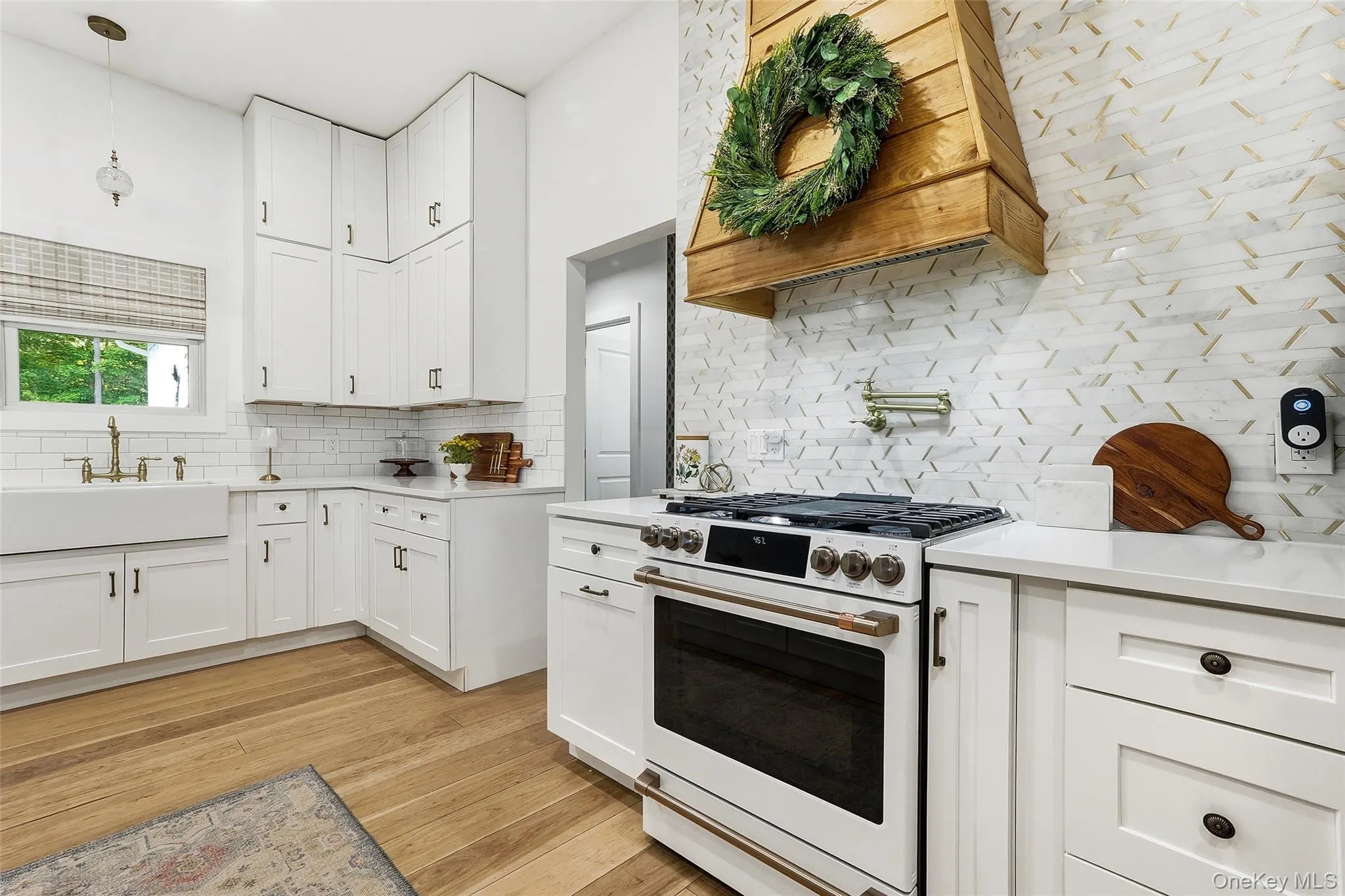 Kitchen featuring custom cabinetry and quartz countertops Kitchen featuring custom cabinetry and quartz countertops