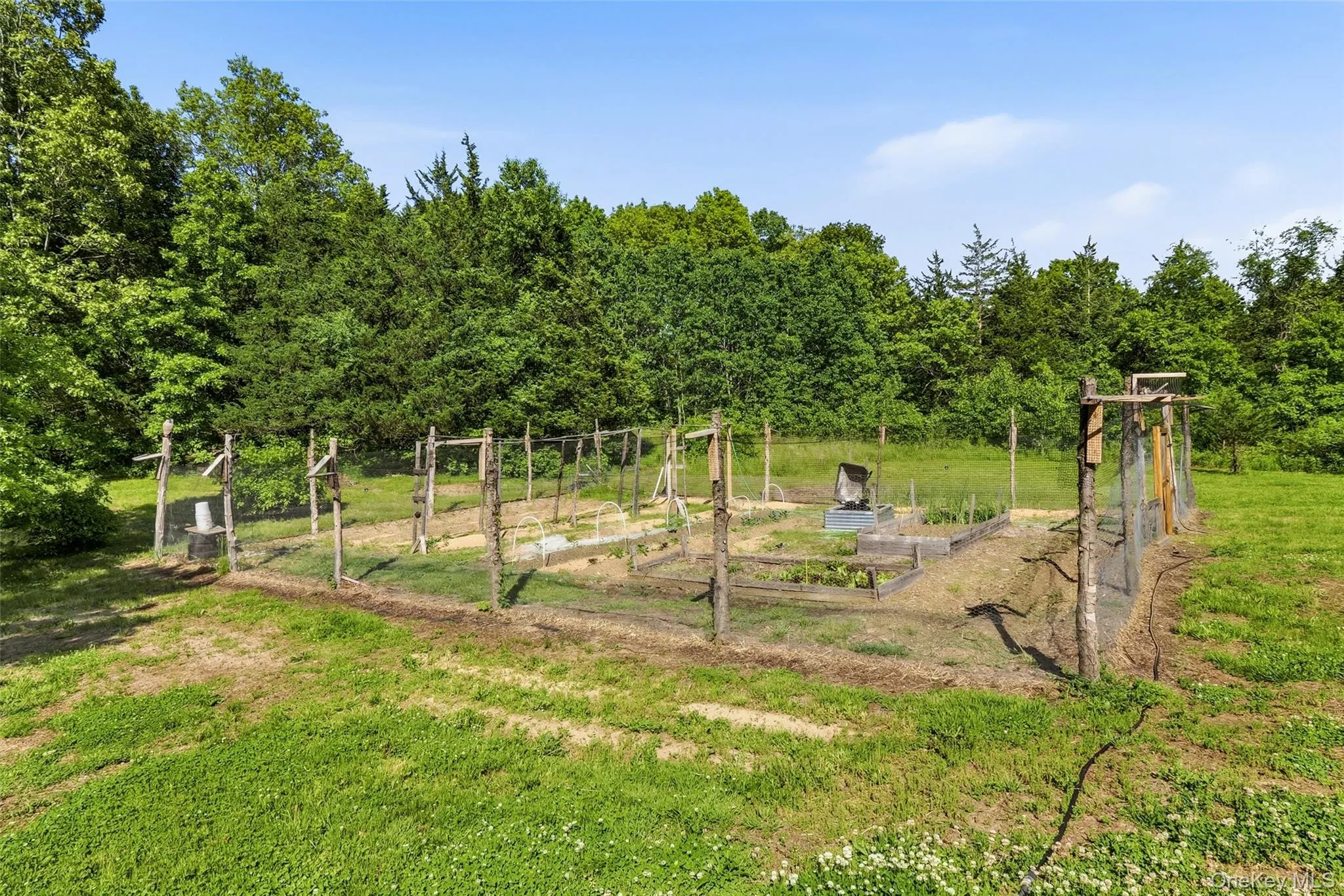 Fenced garden area ready for planting, harvesting, and enjoying the outdoors Fenced garden area ready for planting, harvesting, and enjoying the outdoors