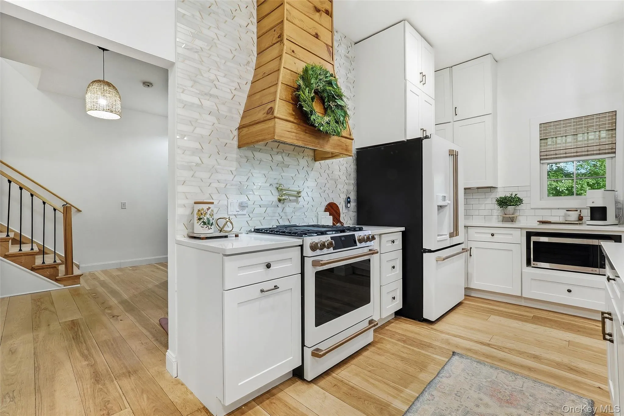 Cafe appliances, custom wood hood and designer finishes Cafe appliances, custom wood hood and designer finishes