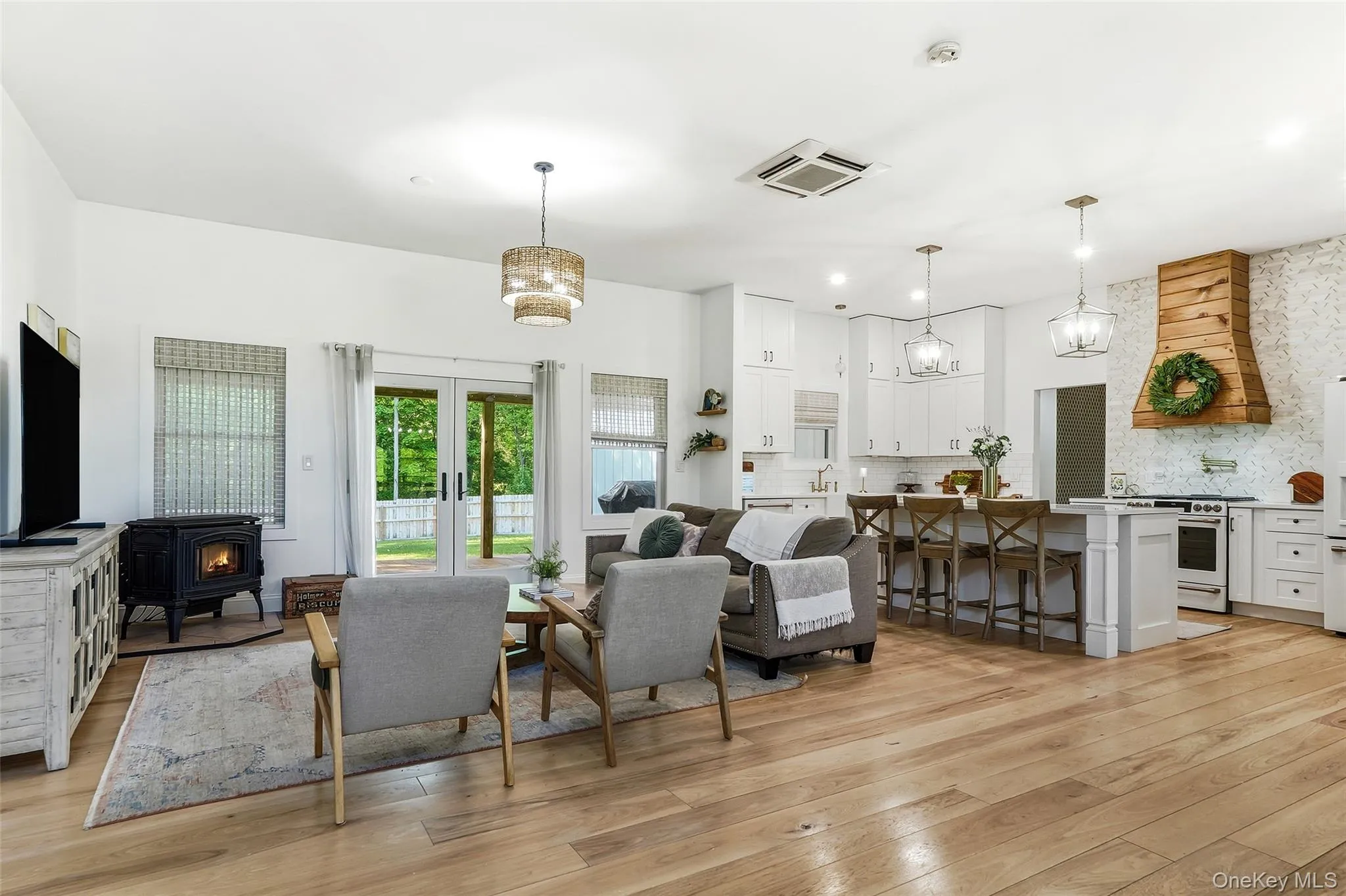 Open-concept living, dining and, kitchen area with soaring ceilings Open-concept living, dining and, kitchen area with soaring ceilings