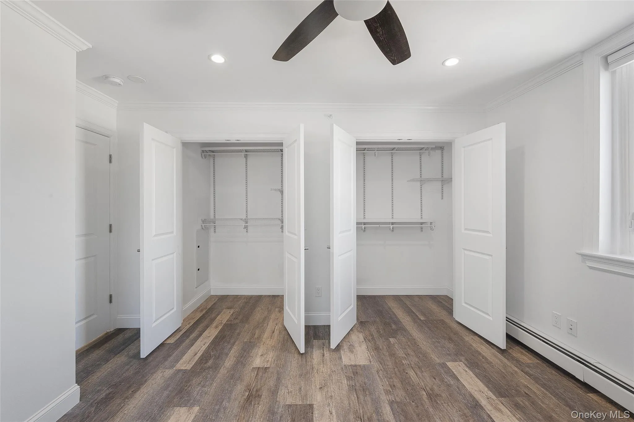 Closet featuring a baseboard radiator Closet featuring a baseboard radiator