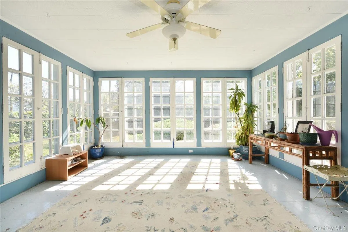 Sunroom with french doors and concrete floors Sunroom with french doors and concrete floors