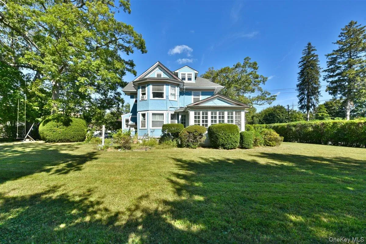 Rear view of property with a lawn Rear view of property with a lawn