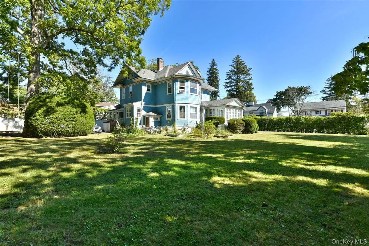 View of front of house with a front yard and a chimney View of front of house with a front yard and a chimney