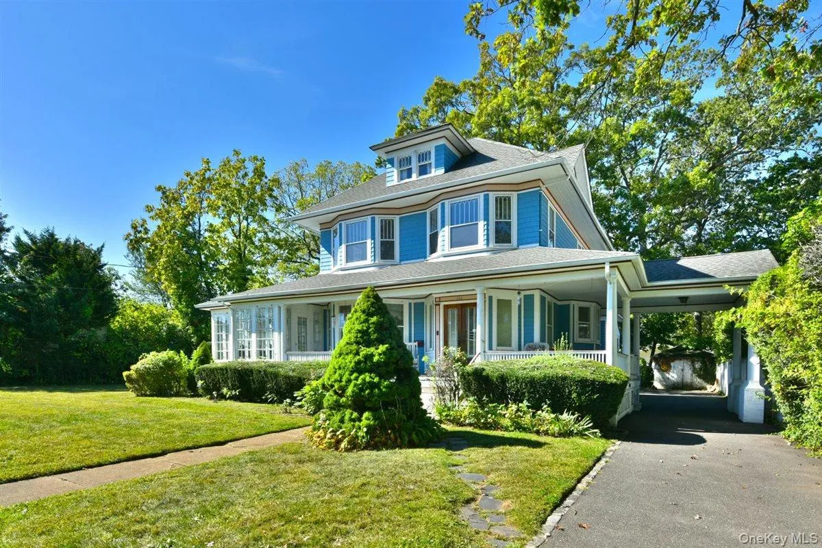 View of front of house featuring covered porch, a front yard, and a shingled roof View of front of house featuring covered porch, a front yard, and a shingled roof