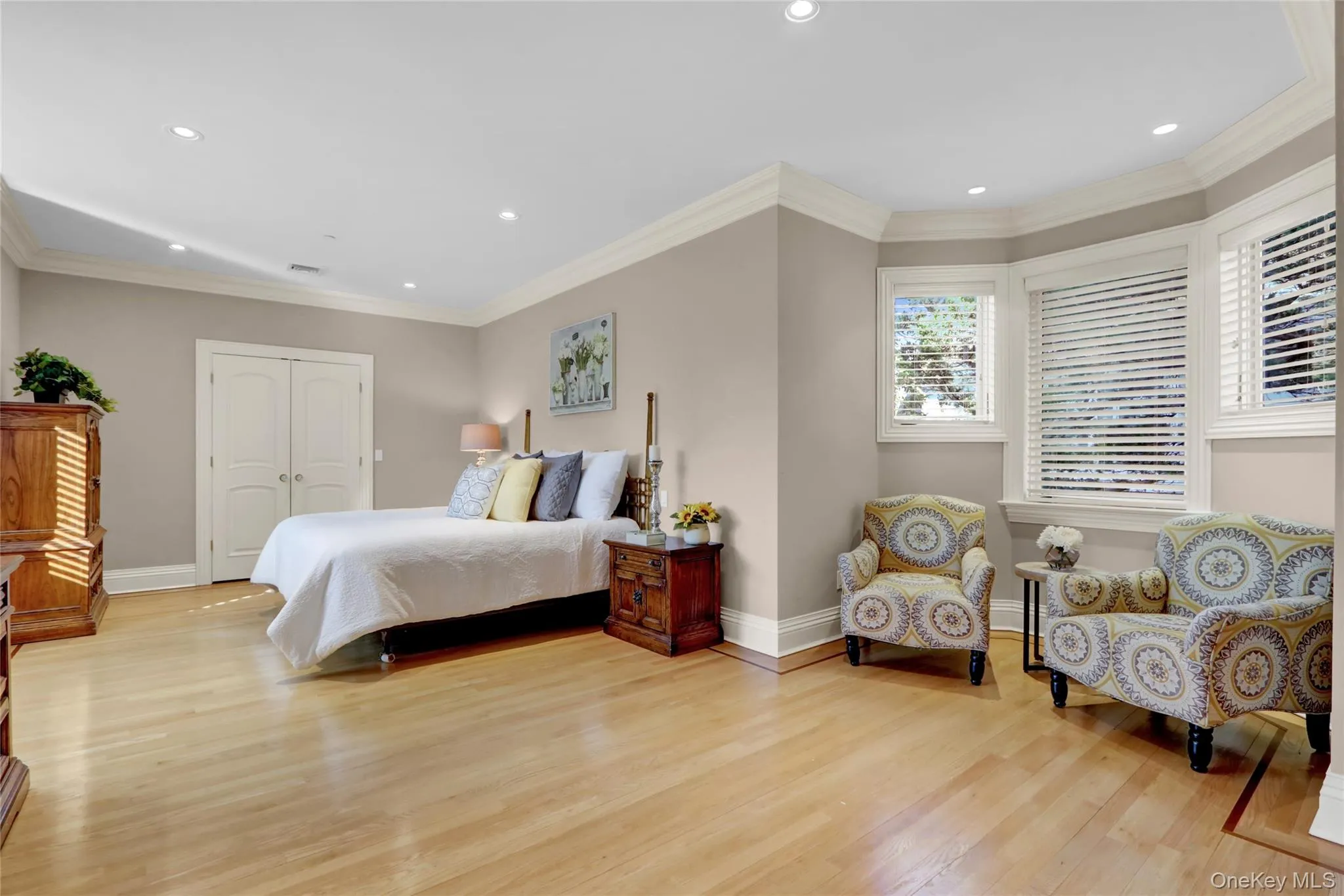 Bedroom with recessed lighting, baseboards, and light wood-style floors Bedroom with recessed lighting, baseboards, and light wood-style floors