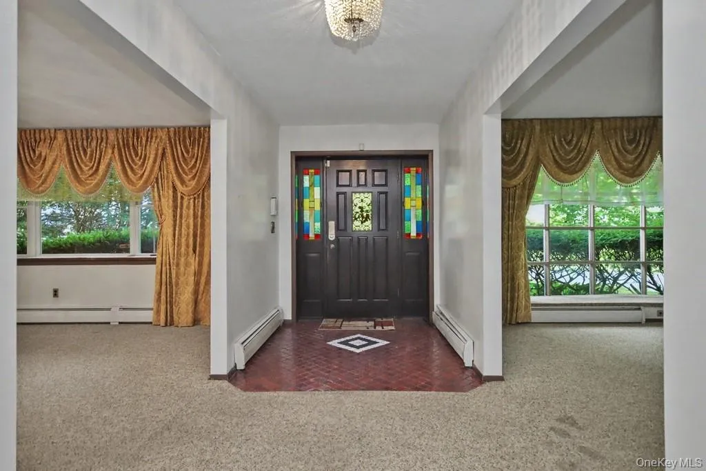 Entry Foyer, to left is dining room, to right is living room Entry Foyer, to left is dining room, to right is living room
