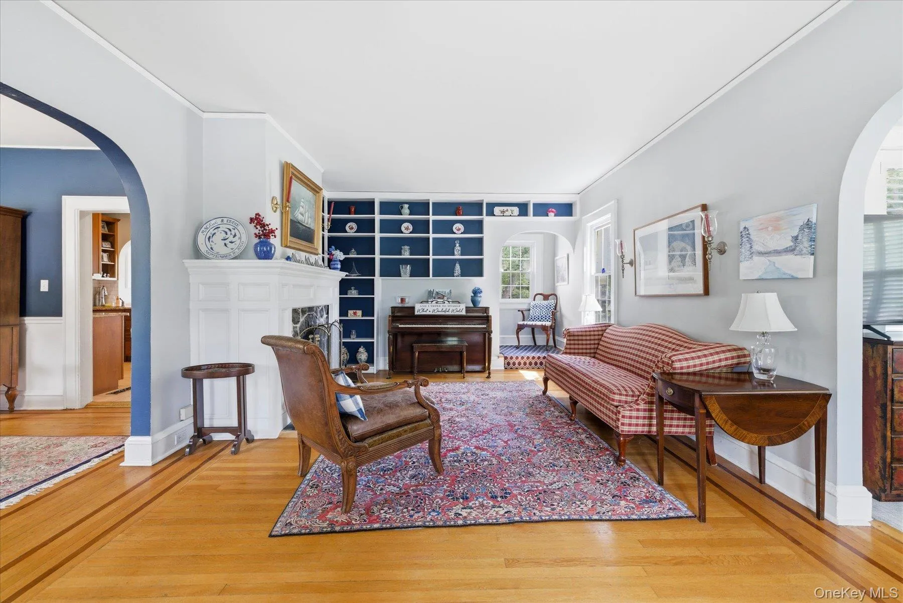 Enter into the beautifully decorated living area with wood burning fireplace and built-ins Enter into the beautifully decorated living area with wood burning fireplace and built-ins
