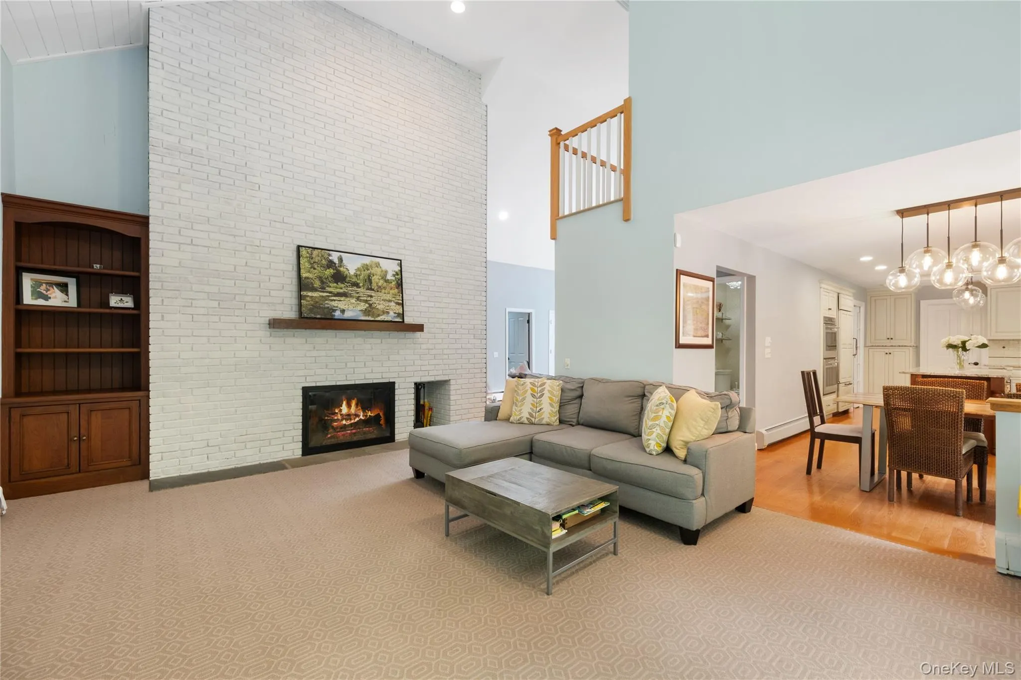 Family room with fireplace and view of open floor plan Family room with fireplace and view of open floor plan