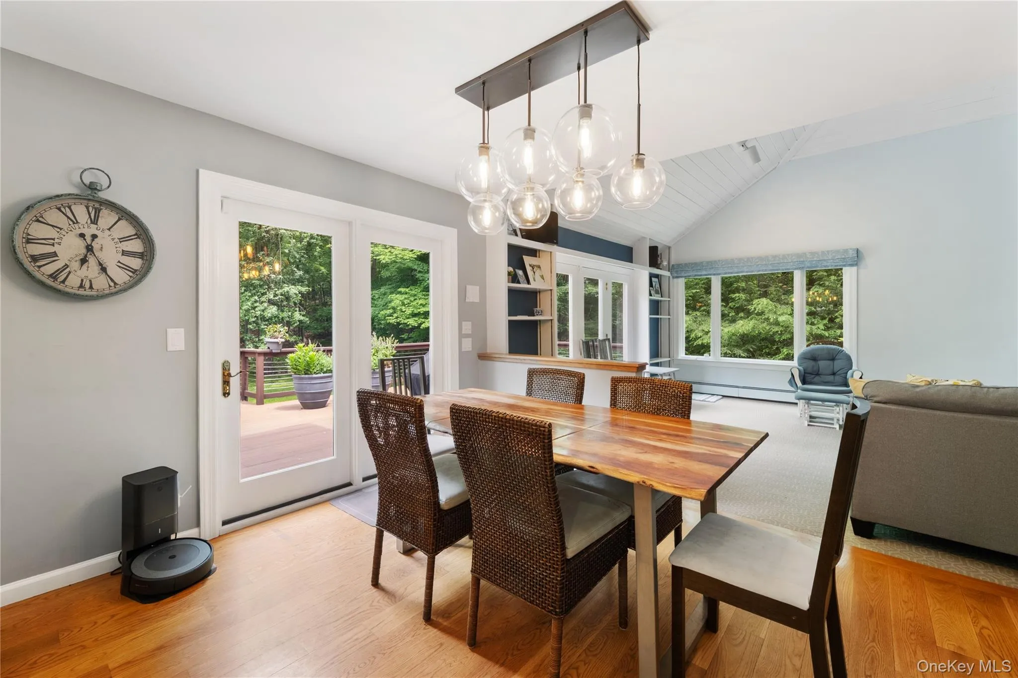 Doors out to the deck and kitchen opens to the family room Doors out to the deck and kitchen opens to the family room