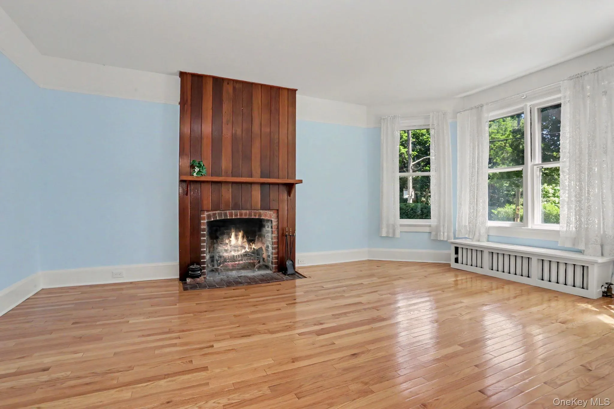 LR with wood burning fireplace. LR with wood burning fireplace.