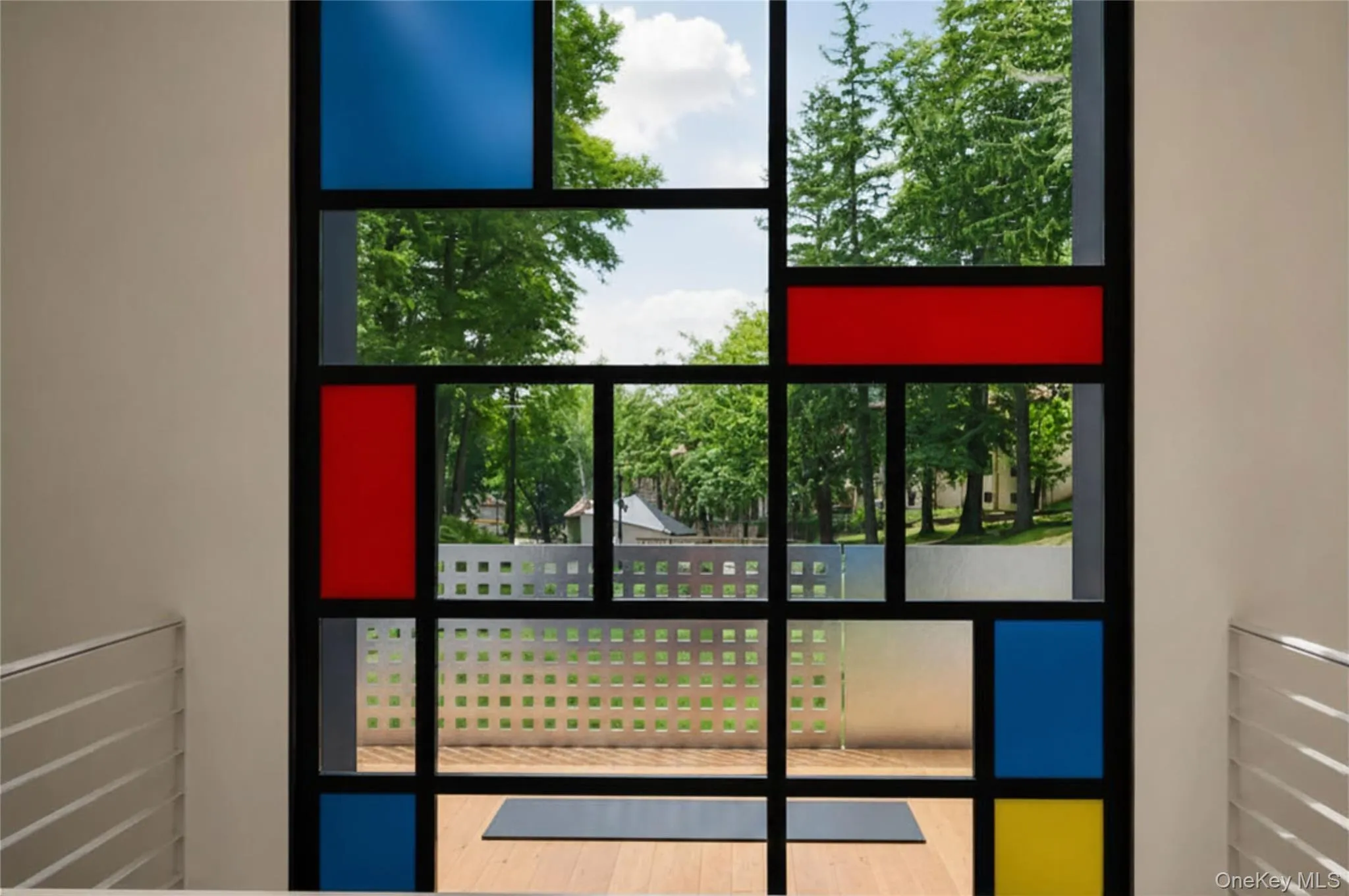 Mondrian-inspired window. It's a centerpiece of the threshold. Back terrace. Mondrian-inspired window. It's a centerpiece of the threshold. Back terrace.
