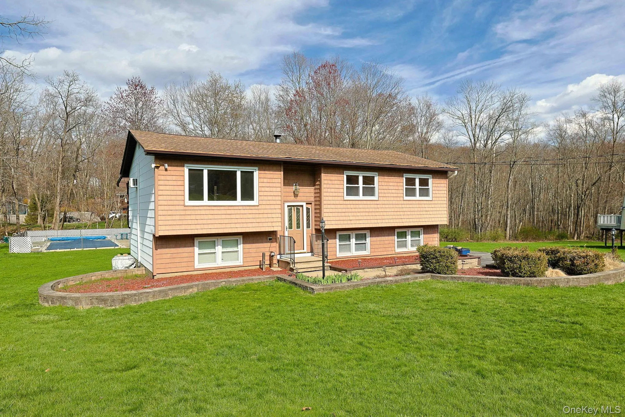 Front of home with view of in ground pool Front of home with view of in ground pool