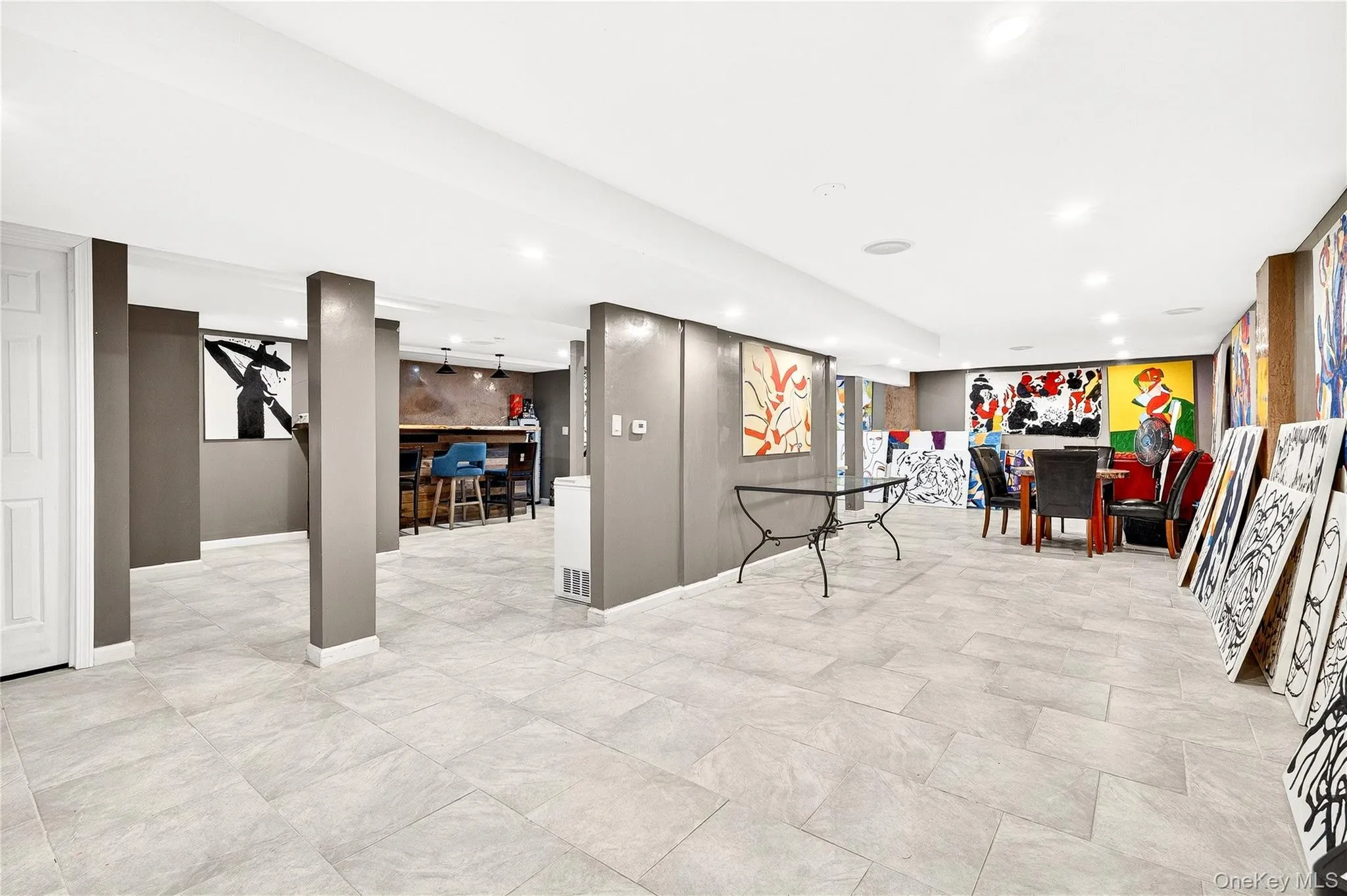 Rec room featuring recessed lighting and an accent wall Rec room featuring recessed lighting and an accent wall