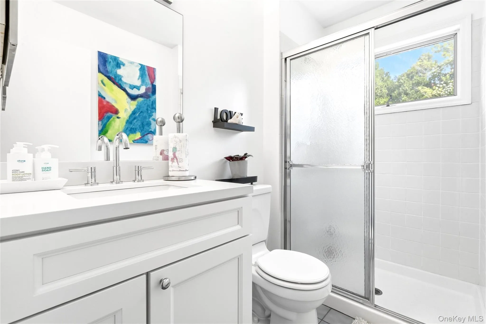 Full bathroom with vanity and a stall shower Full bathroom with vanity and a stall shower