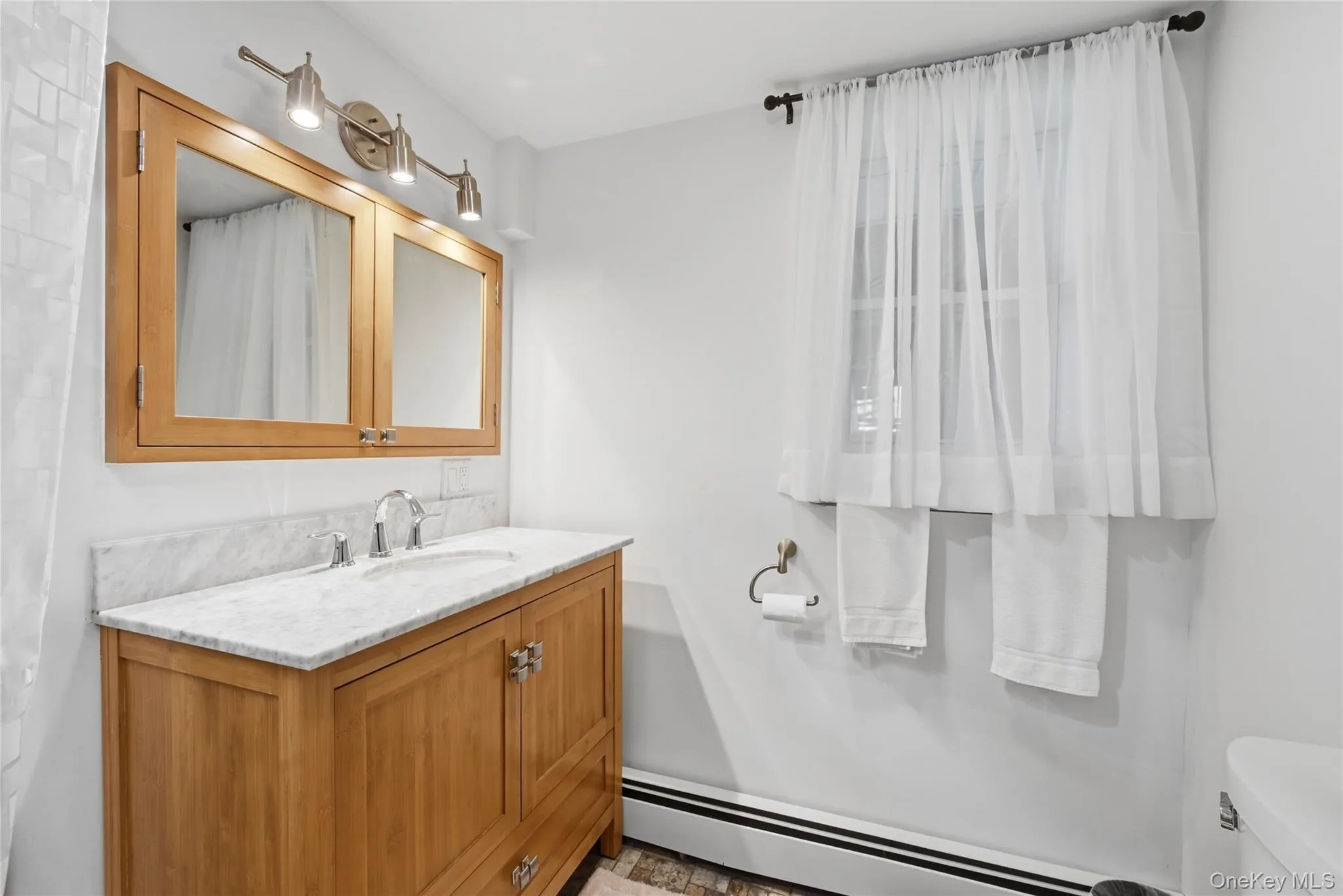 Lower level bath with tile surround and step-in shower Lower level bath with tile surround and step-in shower