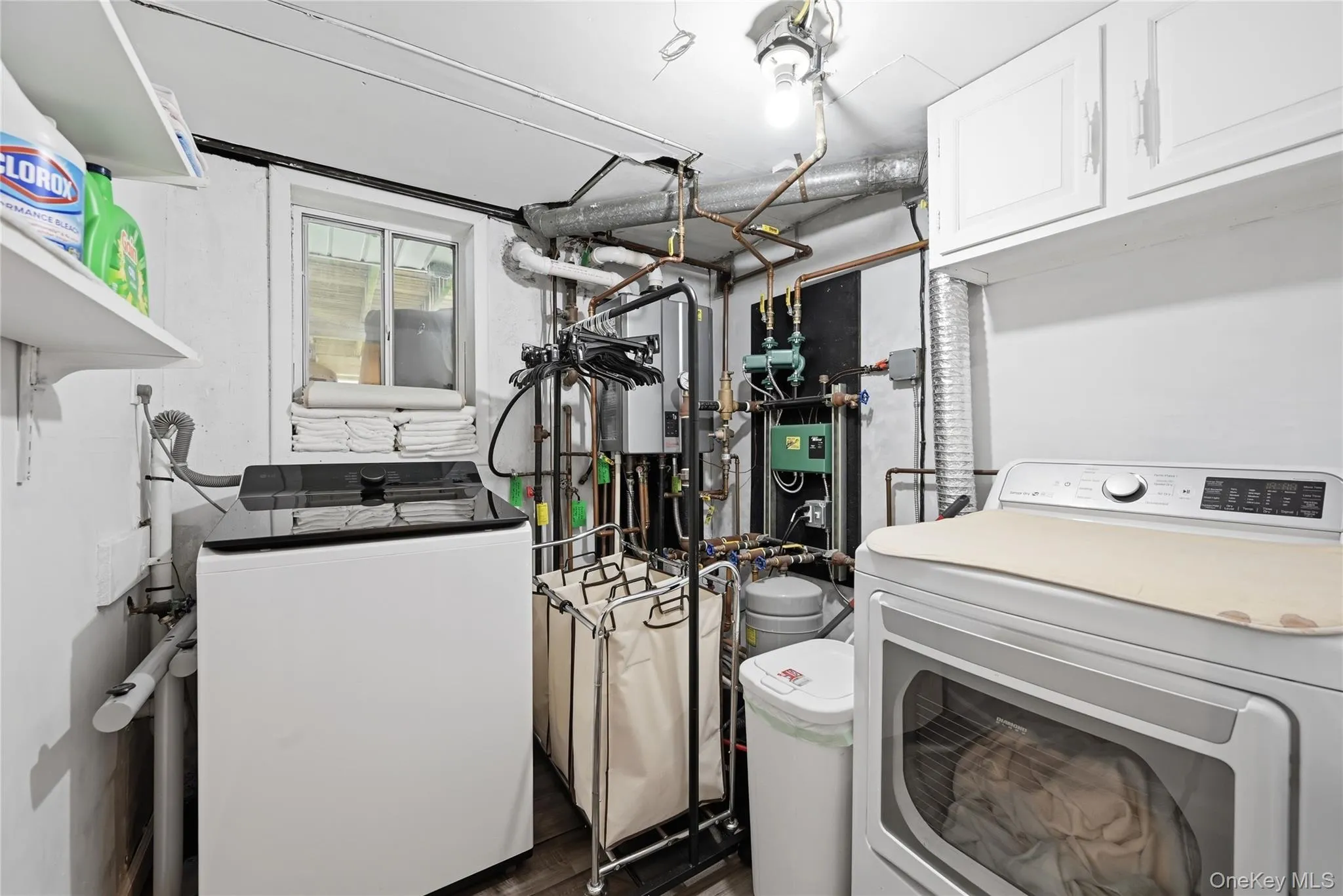 Laundry/utility room with new appliances and new gas heating system Laundry/utility room with new appliances and new gas heating system