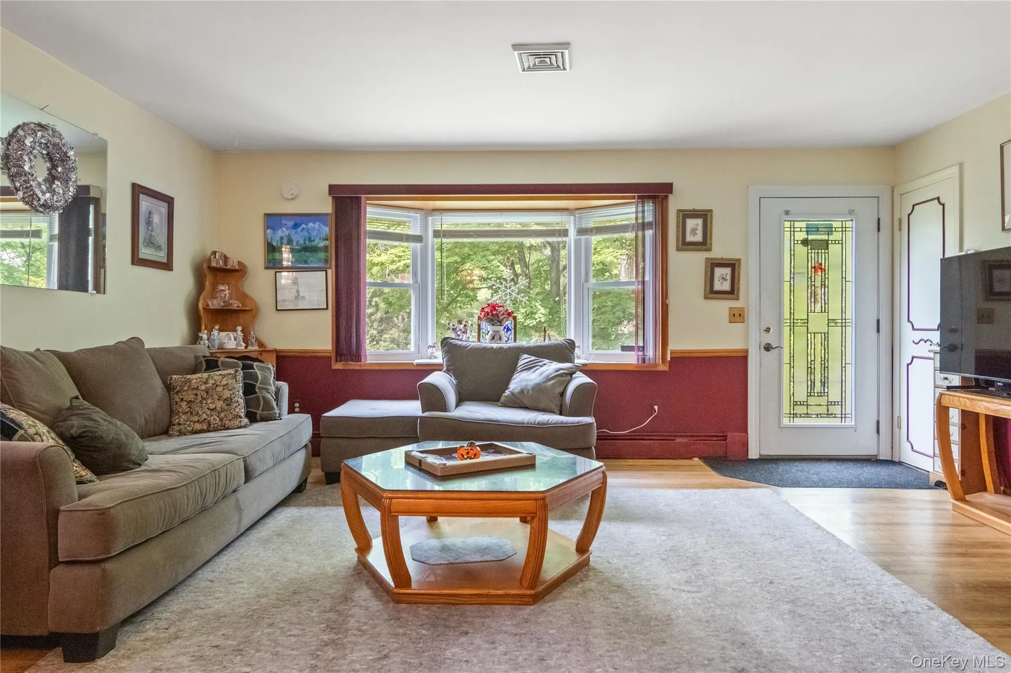 Beautiful bay window in living room lets in lots of natural light Beautiful bay window in living room lets in lots of natural light