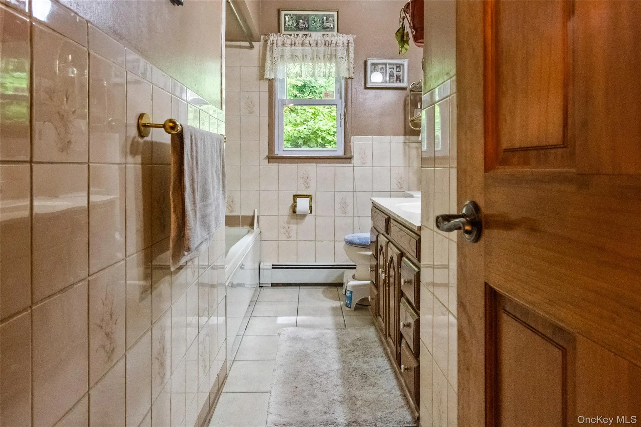 Main floor bathroom with linen closet Main floor bathroom with linen closet