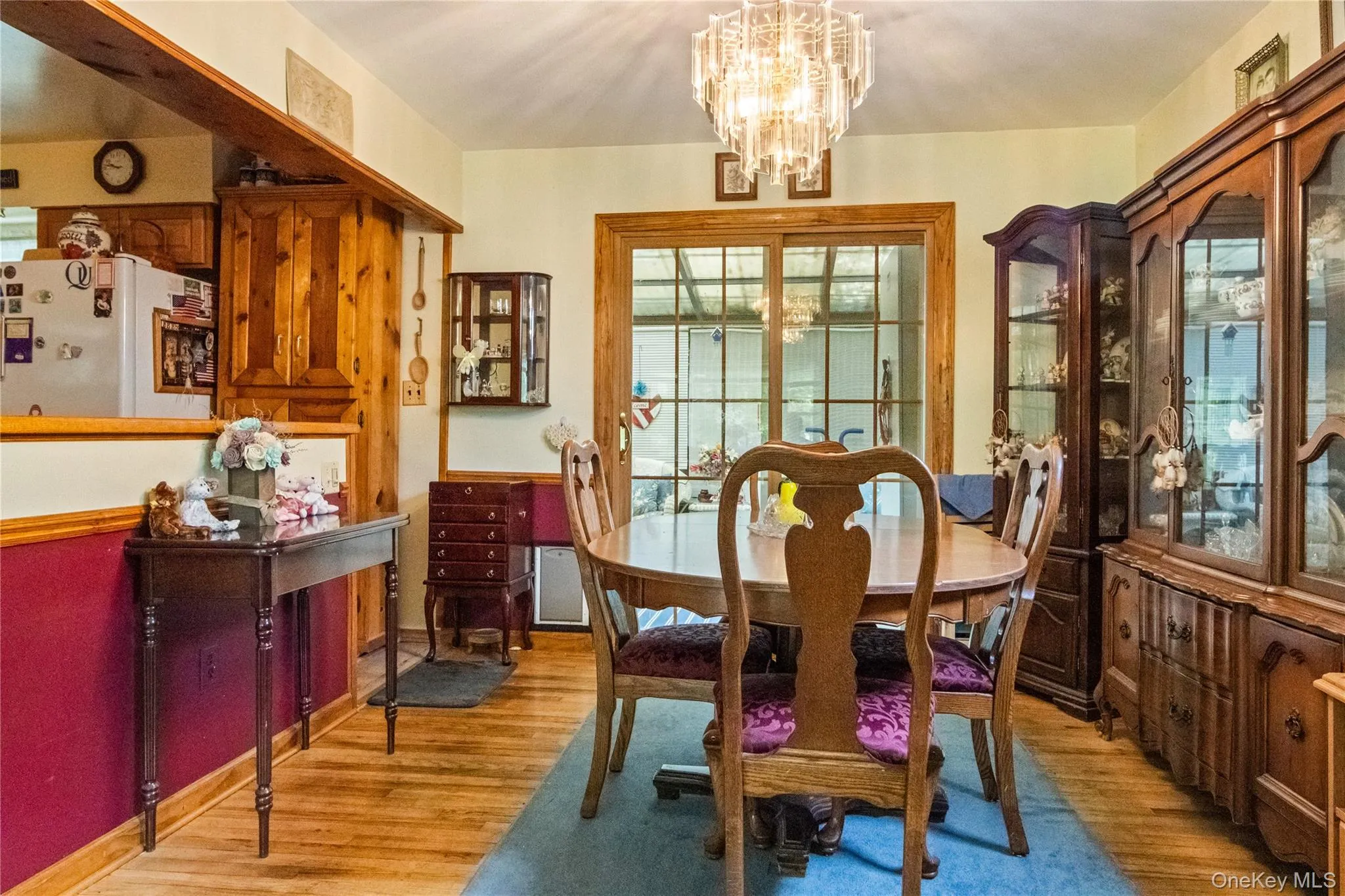 Formal dining room with sliders to the sun room Formal dining room with sliders to the sun room