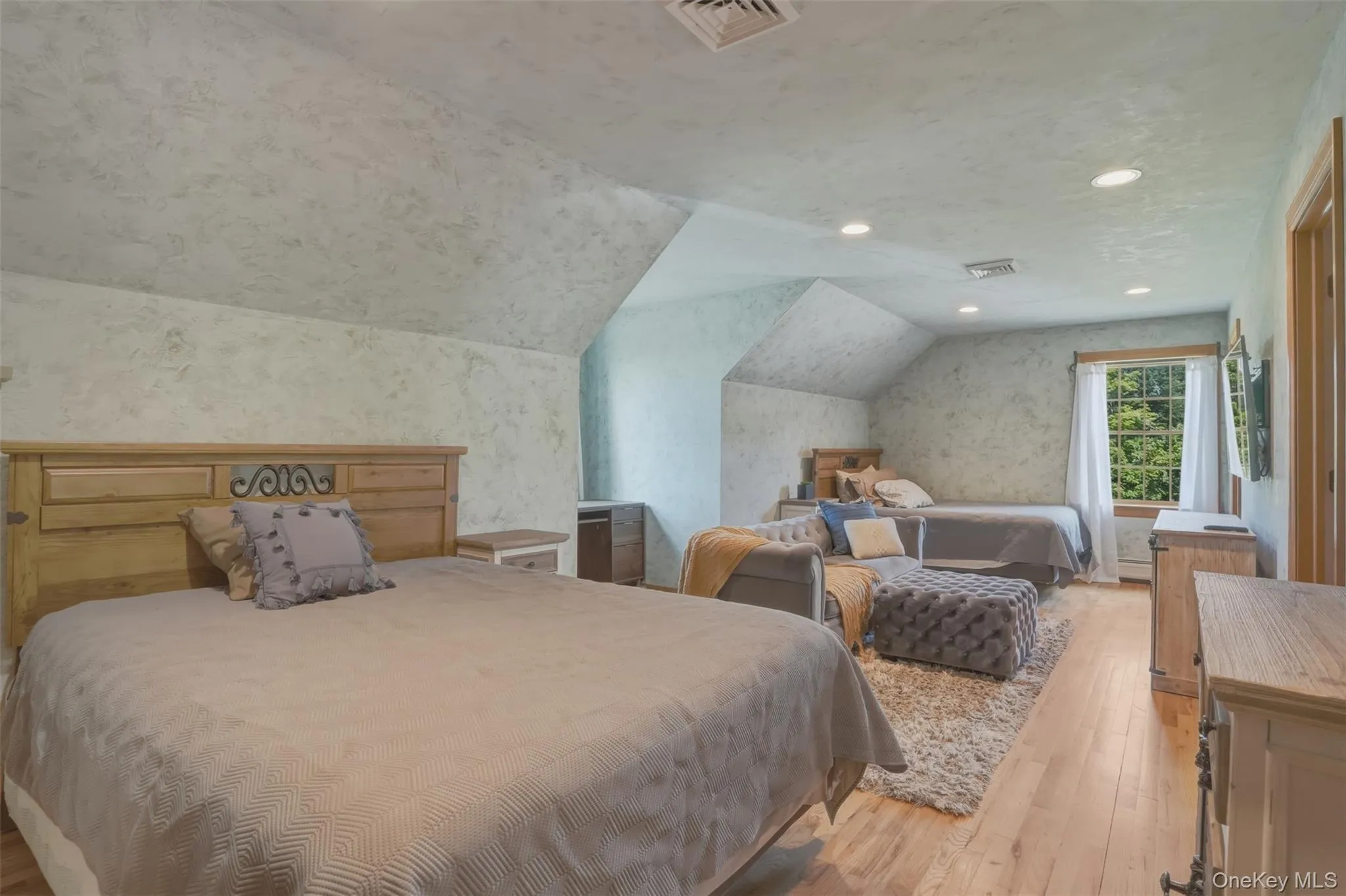 Upstairs, two generously sized bedrooms share a full bath, while a peaceful loft-style sitting area overlooks both the great room below and the picturesque grounds beyond. Upstairs, two generously sized bedrooms share a full bath, while a peaceful loft-style sitting area overlooks both the great room below and the picturesque grounds beyond.