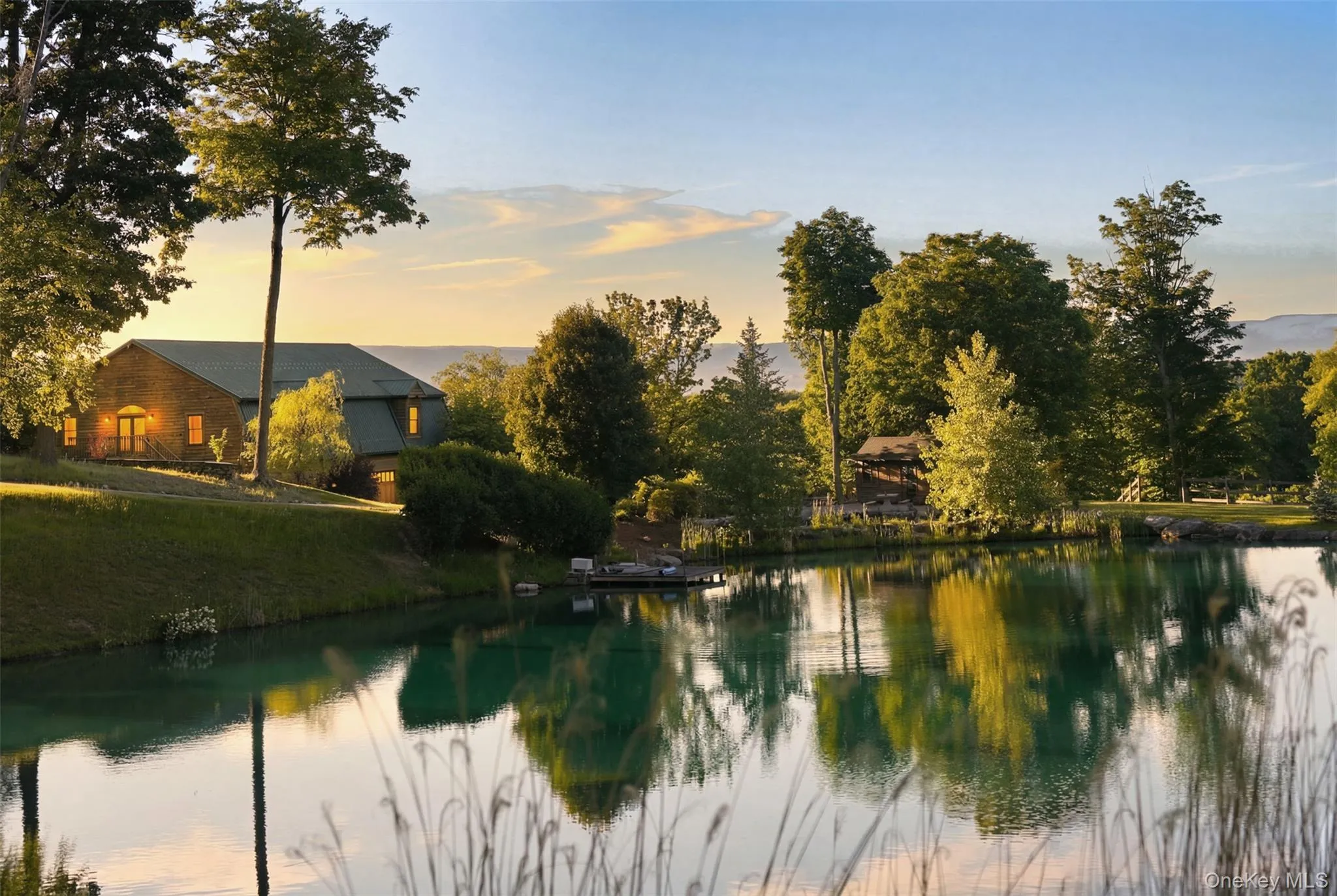 Completing this extraordinary offering is a stunning 1+ acre pond featuring docks, a waterfall, and waterside grilling patio—an idyllic backdrop for fishing, entertaining, or simply enjoying the peace and beauty of the Hudson Valley countryside. Completing this extraordinary offering is a stunning 1+ acre pond featuring docks, a waterfall, and waterside grilling patio—an idyllic backdrop for fishing, entertaining, or simply enjoying the peace and beauty of the Hudson Valley countryside.
