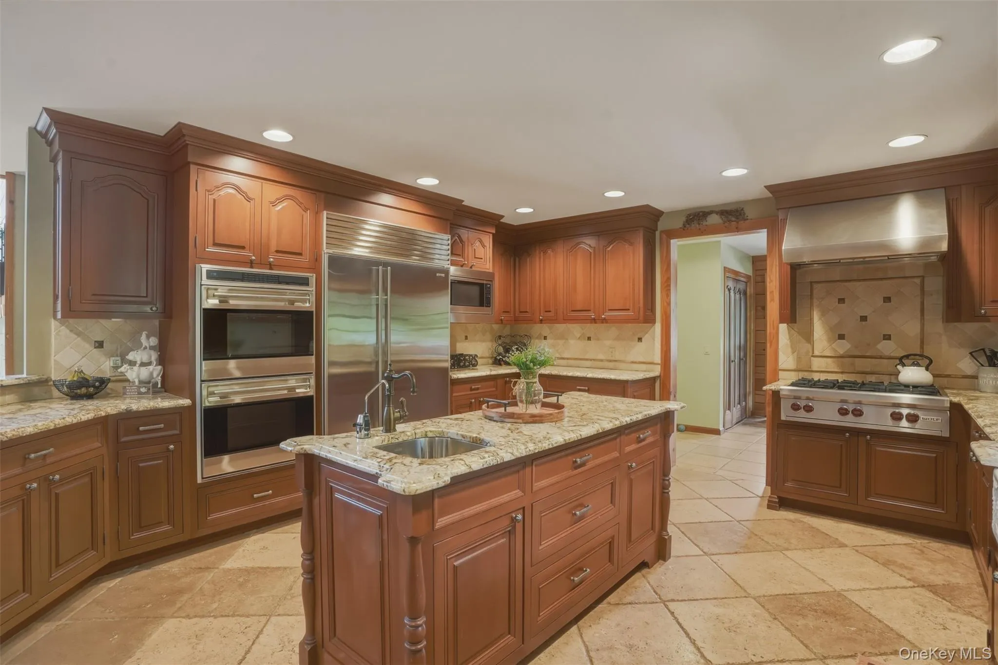 Inside, the home showcases rich wood craftsmanship, soaring ceilings, and breathtaking views of the surrounding mountains, koi ponds, and manicured gardens. The chef's kitchen features custom wood cabinetry, granite countertops, a center island, and spacious dining area, while a practical mudroom includes a convenient dog washing station. Inside, the home showcases rich wood craftsmanship, soaring ceilings, and breathtaking views of the surrounding mountains, koi ponds, and manicured gardens. The chef's kitchen features custom wood cabinetry, granite countertops, a center island, and spacious dining area, while a practical mudroom includes a convenient dog washing station.