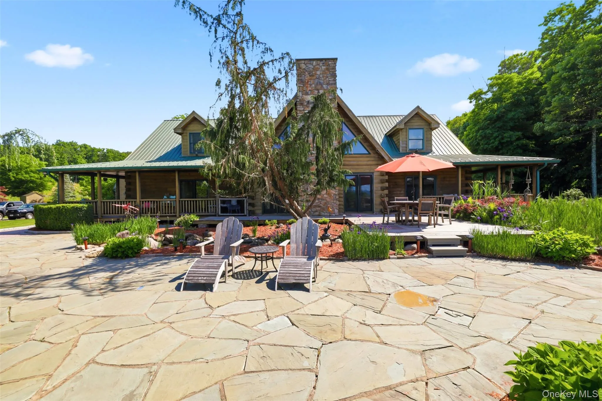 Beautiful front patio area with koi pond, gazebo, gardens and grilling station Beautiful front patio area with koi pond, gazebo, gardens and grilling station