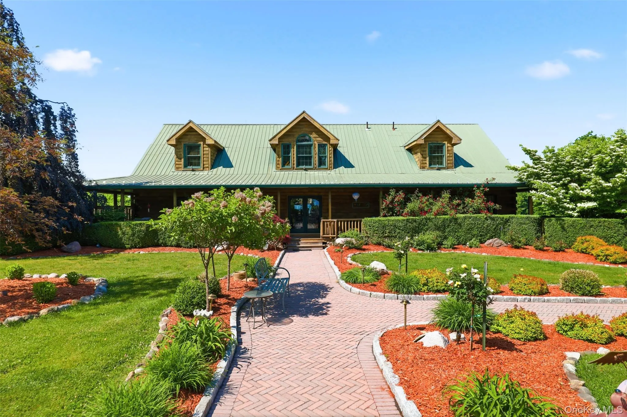 Beautiful gardens and paver pathways to the pool area Beautiful gardens and paver pathways to the pool area